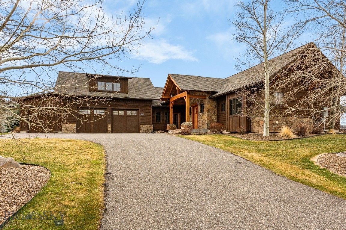 ?Welcome HOME to 40 Ramrod Place, a beautifully crafted custom home designed by Sandholm Architects and built by Alpenglow Custom Home Builders offering a seamless blend of Montana character and modern comfort, seated on a quiet cul-de-sac in the highly sought-after Black Bull Golf Community, and backing to Montana State University open, agricultural land, holding sweeping views of multiple mountain ranges. Designed with approximately 2,700± square feet of living space, this home features 4 bedrooms and 3.5 bathrooms, including a well-appointed main-level primary suite that provides a private retreat at each day's end. The thoughtfully laid out, open-concept main level living area is filled with natural light and anchored by a striking 2-sided stone fireplace, creating a warm and inviting atmosphere for everyday living and for hosting family and friends. The home is equipped with central air conditioning and speakers for sound inside and out. The home's kitchen flows effortlessly into the dining and living spaces, while rustic hardwood floors, reclaimed wood accents, and vaulted ceilings add texture and charm throughout. A wet bar enhances the home’s entertaining appeal, and multiple access points lead to the covered patio and outdoor living area with an elevated circular, stone fire pit where you can enjoy Montana’s expansive skies and peaceful surroundings. This thoughtful floor plan places the guest bedrooms on the opposing end of the residence from the primary suite for added privacy. The homes second level provides a private guest suite complete with its own kitchen, bathroom, and living space offers flexibility for guests, extended stays, or an incredible flex space to use as you desire. Set on over half an acre, the property is beautifully landscaped and includes a spacious three-car attached garage, providing ample room for vehicles, gear, and storage. Located within Black Bull, residents enjoy access to community amenities including a golf course, pool, fitness center, and clubhouse, all just minutes from Bozeman and Bozeman Yellowstone International Airport and only a short drive from Big Sky Resort, Bridger Bowl, the Gallatin, Madison and Yellowstone Rivers. This property offers a rare opportunity to enjoy refined living in one of Bozeman’s premier communities, with the perfect balance of privacy, views, and convenience to extensive outdoor recreation and all things Bozeman.