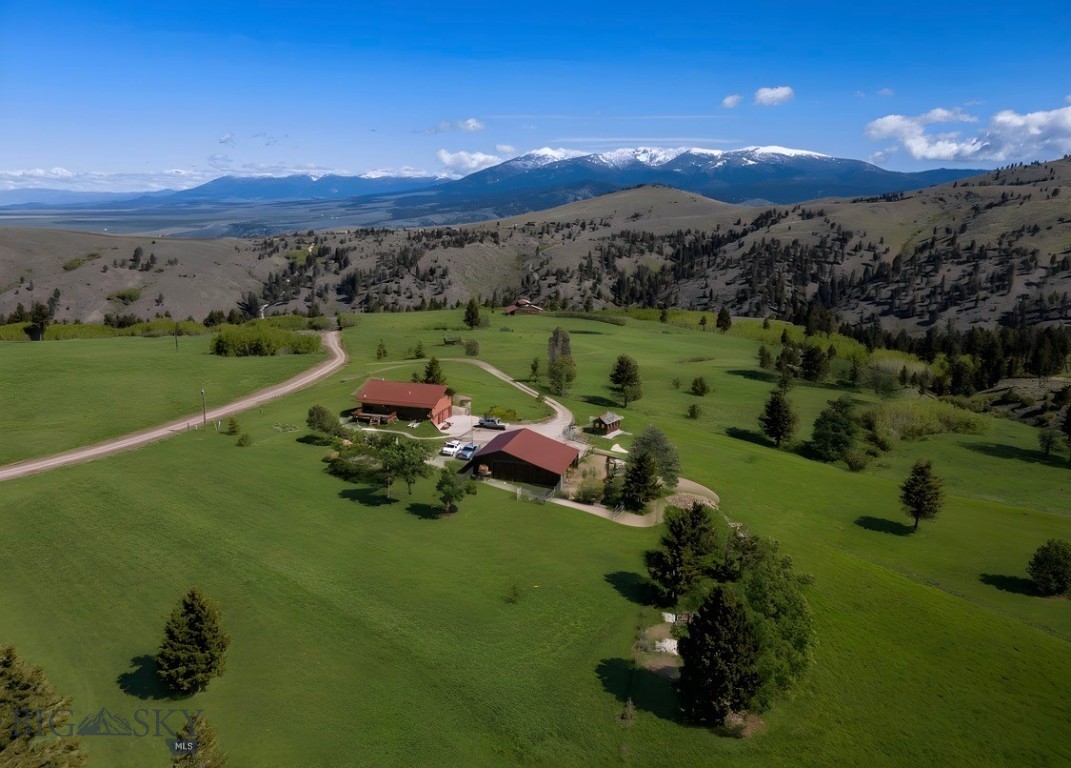 Welcome to your private 20-acre Montana retreat—tucked near the end of the road for unmatched seclusion, abundant wildlife, and wide-open skies. This exceptional property offers not just a home, but a true outdoor lifestyle in a sought-after hunting district, where deer, elk, and other native game are frequently seen right on or near the property.
The stunning log home showcases vaulted ceilings and rustic elegance, blending comfort with classic Montana charm. The main level features three spacious bedrooms and two full bathrooms, while the daylight basement offers a non-conforming one-bedroom suite with a private entrance perfect for guests, multi-generational living, or rental potential.
After a day outdoors, pull into the oversized heated tuck-under garage—complete with two floor drains—designed for convenience in every season.
The land is fully fenced with two established pastures, making it ideal for horses or livestock. A large barn provides ample space with room to expand, and the heated tack room is a rare and thoughtful touch. Grow your own food in the well-established greenhouse and enjoy the natural seasonal spring that runs from April through August in most years—adding both beauty and utility to the land.
Located just 20 minutes from Townsend via a well-maintained county road, you’ll enjoy the perfect balance of accessibility and peaceful isolation.
Whether you're looking for a full-time residence, a recreational getaway, or a basecamp for hunting and outdoor adventure, this property delivers a rare combination of comfort, acreage, and location.
Opportunities like this don’t come around often experience it for yourself.