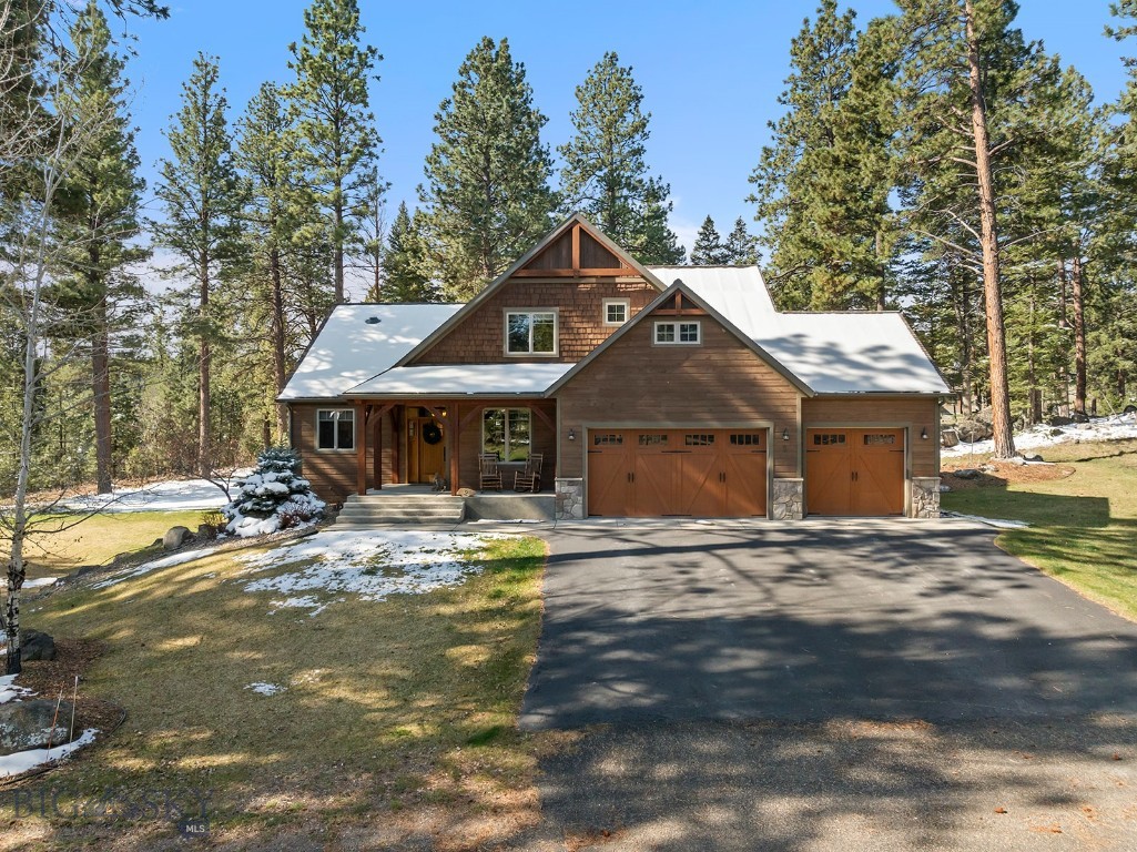 Set within the highly desirable Jack Mountain Estates in Clancy, this exceptional timber-frame residence offers a rare blend of refined luxury and Montana beauty on 1.2 +/- private acres. The secluded lot features mature Ponderosa Pine trees creating a very private setting. Designed for effortless main-level living, the home showcases warm walnut flooring, a vaulted great room anchored by a gas fireplace, and custom built-ins. The primary suite, gourmet kitchen with generous pantry, and dedicated office make everyday living easy. Upstairs you'll find two spacious bedrooms, a full bathroom, and a versatile flex space. The expansive lower level is equally impressive, featuring a spacious family room, two additional bedrooms, and a full bath—ideal for guests or multi-generational living. The property is nicely landscaped, with raised garden beds, and irrigation to enhance the setting. It’s not uncommon to see elk, deer and other animals passing through. A three-car garage, new furnace, fiber internet, and easy paved access to Helena ensure convenience without compromise.