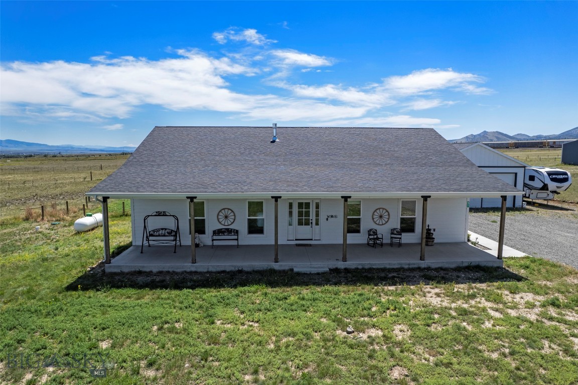 Experience the best of Montana living in this beautifully crafted custom ranch home on 2.36 acres in the desirable Lake Vista Subdivision near Canyon Ferry Lake. Built in 2022, this 4-bedroom, 2-bathroom home offers 2,160 sq. ft. of thoughtfully designed single-level living with premium finishes, panoramic mountain views, and exceptional indoor-outdoor living.

The inviting open floor plan features rich hardwood floors, oversized windows that flood the home with natural light, recessed lighting, and a stunning floor-to-ceiling stacked stone gas fireplace with a custom wood mantel. The gourmet kitchen is designed for both everyday living and entertaining, complete with granite countertops, custom cabinetry, stainless steel appliances, double wall ovens, a tile backsplash, designer pendant lighting, and a large center island with seating.

The spacious primary suite is a private retreat featuring a spa-inspired ensuite with dual quartz vanities, a freestanding soaking tub, a custom tiled walk-in shower, and beautiful mountain views. Three additional bedrooms and a well-appointed guest bath provide flexibility for family, guests, or a home office.

Enjoy Montana's breathtaking scenery from the expansive covered front porch or backyard with endless Big Sky views. The property also includes a newly built 30' x 40' detached shop, perfect for vehicles, RVs, boats, recreational equipment, hobbies, or a workshop.

Located just minutes from Canyon Ferry Lake, you'll enjoy convenient access to boating, fishing, hiking, hunting, and year-round recreation while remaining close to Townsend's schools, shopping, dining, and amenities. Whether you're searching for a full-time residence, recreational retreat, or your own slice of Big Sky Country, this exceptional property offers luxury, functionality, and the peaceful Montana lifestyle you've been dreaming of. Schedule your private showing today!