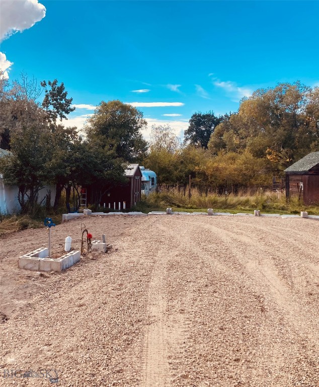 0.122-acre parcel in Sheridan, Montana ,offering an ideal opportunity for seasonal recreational use. This property may be well suited for RV parking during permitted times of the year, subject to Madison County and Town of Sheridan regulations. Park your RV and enjoy a convenient basecamp while taking in Southwest Montana’s beautiful summers filled with fishing, camping, hiking, and exploring the wide-open landscapes the area is known for. The parcel is located within a FEMA-designated floodway. Buyers are strongly encouraged to conduct independent due diligence and consult with the Madison County Planning Department regarding allowable uses, seasonal restrictions, permitting requirements, floodplain regulations, and any development limitations. Prospective purchasers should also verify flood insurance requirements and confirm any applicable county, state, or federal regulations prior to closing.