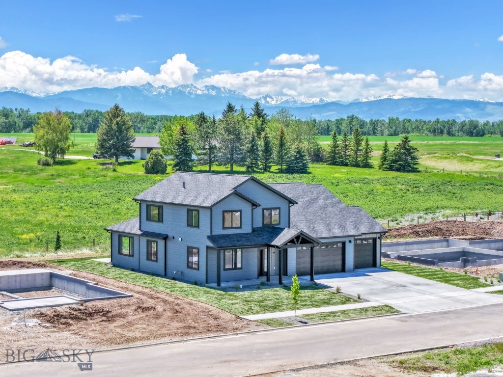 What a location! Five minutes from Bozeman, and five minutes from Four Corners, yet located outside the city limits. This beautiful four-bedroom house offers a spacious kitchen, walk-in pantry, and ample cabinet space. It features tall living room ceilings and a spacious master suite with an oversized walk-in closet. The home boasts an extra living space upstairs and a 3-car garage. All of this is situated with southern facing mountain and farmland views, with completed landscaping, underground sprinklers, and air conditioning. This home is ready to enjoy summer