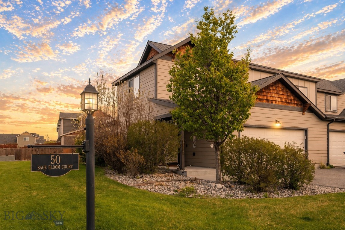 Welcome to 50 Sage Bloom, Unit A — a bright, end-unit, two-car garage townhome-style condo nestled in Bozeman's desirable North Star neighborhood. This 1,558 SF home lives large with thoughtful design and family-friendly living. The main level opens to an inviting living and dining area filled with natural light, flowing seamlessly into the updated kitchen — outfitted with new appliances in 2025 — arranged for both everyday use and relaxed entertaining. One of the best features of this home is the main floor primary bedroom, complete with new wood flooring installed in 2025 and the convenience of main-level laundry. Upstairs, you'll find two generously sized bedrooms and a full bath providing comfortable space for family, guests, or a home office, all with new carpet installed in 2026. Outside, enjoy a fenced-in backyard as well as a large side lawn with underground irrigation — offering plenty of space to relax, play, or let the pets roam. As an end unit, added privacy and an abundance of natural light come standard. Steps from Quail Run Park — complete with a playground, pavilion, and full-court basketball — and surrounded by miles of walking trails, this home puts outdoor recreation right at your doorstep. Combined with the highly sought-after Monforton school district, this is a rare opportunity for families and those seeking the best of Bozeman living. About ten minutes to downtown Bozeman, five minutes to the Gallatin River, and roughly forty minutes to Big Sky — this turnkey condo offers the perfect balance of comfort, convenience, and the Montana lifestyle. Contact us today to schedule a private showing.