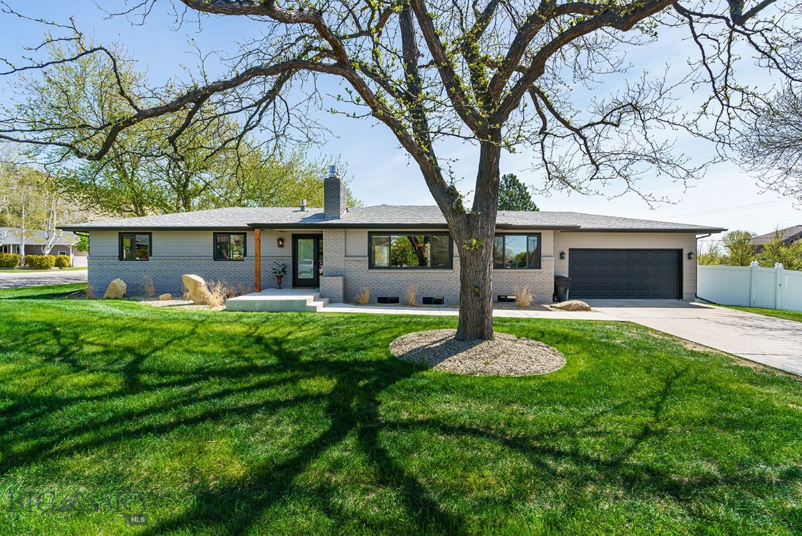 This fully modernized home near the rims of Billings offers views and a private setting. Step inside to an open living space with abundant natural light and timeless details. The inspiring kitchen boasts handmade ceramic tile backsplash, Sage green cabinets, quartz countertops, and a 6-burner gas stove with a pot filler. The primary suite captures stunning backyard views, while the ensuite showcases beautiful glass tile design, double shower heads with body sprays, and a vanity bathed in natural light. Two additional bedrooms and a full bath complete the main level. Downstairs, discover a spacious retreat for games or movies, featuring a wet bar that highlights the original swanky wallpaper for a sophisticated speakeasy feel. A large bath and two additional bedrooms offer a ideal haven for guests. The landscaped lot includes a new fully fenced yard, offering space for outdoor living, recreation, or pets. Info deemed reliable but not guaranteed. Buyer/buyer agent to verify.