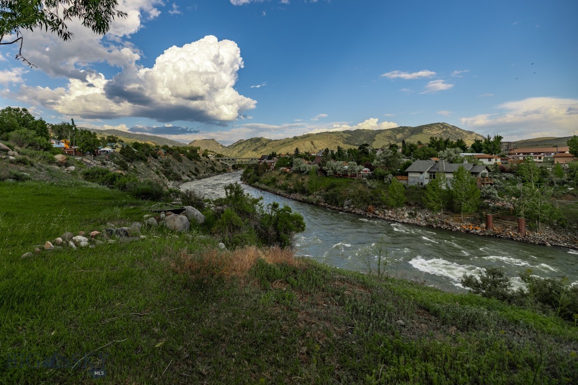 Discover an exceptional investment opportunity just steps from Yellowstone’s north entrance. Located less than five minutes from the park and a short walk from historic Main Street, this property offers breathtaking views and unmatched versatility.

Unrestricted by zoning, you have the freedom to bring your vision to life—whether that means building your dream home, establishing a boutique hotel, creating vacation rentals, or opening a restaurant or retail space. The property comprises four parcels bordering the Yellowstone River and includes 11 fully serviced RV sites. Additionally, the larger lot features a single-family home that has consistently generated income.

The residence is an eco-friendly green modular home—a two-bedroom, two-bath retreat powered by solar energy that has proven popular on Airbnb. Enjoy spectacular views of the Yellowstone River, the iconic Gardiner bridge, and the historic Roosevelt Arch, all while relaxing in a hot tub in a beautifully landscaped backyard.

Gardiner’s unique charm, coupled with its year-round open north entrance to Yellowstone National Park, attracts visitors throughout every season including winter adventurers and wildlife enthusiasts heading to Lamar Valley and Cooke City.

This property is a rare chance to invest in a slice of paradise where opportunity meets nature. To truly appreciate its beauty and potential, you must see it in person—photos simply can’t capture the full experience. Contact the listing agents today to schedule your tour and discover the endless possibilities awaiting you in this remarkable location.