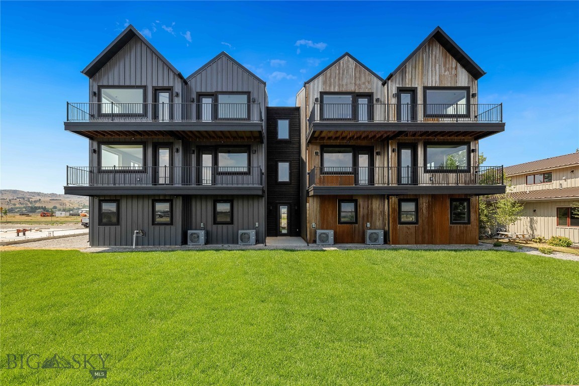Set against the wide-open landscapes and river corridors that define the Madison Valley, The Drift at North Forty presents an opportunity to acquire an entire new construction four-unit residential building in the heart of Ennis. Located within walking distance of Main Street and minutes from the Madison River, the property offers investors a turnkey asset positioned at the intersection of small-town access and world-class outdoor recreation.

The building consists of four 3-bedroom, 2-bathroom residences designed for low-maintenance ownership. Each home features an open-concept layout with expansive windows that capture mountain views and bring in natural light. Finishes are durable and clean, designed with a timeless aesthetic that complements the surrounding landscape while minimizing ongoing maintenance.

Residences are configured for flexibility, appealing to both long-term occupants and vacation renters. Walkout primary suites provide privacy and direct outdoor access, while two additional bedrooms allow space for guests, family, or remote work. Attached one-car garages and dedicated storage rooms provide practical utility, with additional space suitable for fly tying, workout equipment, or organized gear storage.

Short-term rentals are permitted, offering investors the ability to pursue nightly rental income while maintaining optionality for longer-term leasing or personal use. Upper-level residences benefit from elevated sightlines and broader valley views.

With Main Street Ennis, the Madison River, and surrounding public lands nearby, the property is well positioned for year-round demand driven by fly fishing, hunting, hiking, and skiing at Big Sky Resort. Yellowstone National Park and Bozeman Yellowstone International Airport are approximately one hour away, placing The Drift at North Forty within reach of both regional and destination travel markets.