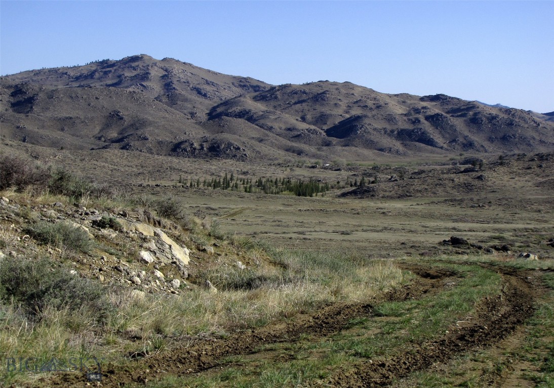 Escape to the mountains of Southeast Wyoming... 37.5 acres bordering 160 acres State Public land in the rugged Laramie Mountains! This remarkable property offers a unique blend of the end of the road privacy, gorgeous unobstructed views, natural beauty and secluded tranquility. Located in Albany County, Wyoming, it is 45 miles NE of Laramie and 90 miles NW of Cheyenne, Wyoming. Power is a mile away, so solar would be a good option. There is a developed spring in the southeast corner that feeds a water tank for livestock that usually flows much of the year.  There is also a small spring creek that usually flows for part of the year on the eastern edge of the land as well. The land has a few pine and juniper trees, some impressive granite boulders, some great elevated build sites and pasture for some animals (no restrictions). It is approx. 4 miles off the state highway and about 2 miles off the county maintained road! It is fenced on the south border and the spring area is fenced off by itself. The closest town is 32 miles to the NE, Wheatland (pop 4000). Cell phones work on this property. Wildlife includes elk, mule deer, whitetails, bighorn sheep, antelope & turkeys, as well as upland game birds. Folks do live here year-round, some have retired here, while others use it for a weekend getaway far from the city lights. Roads are maintained by property owners as desired. Winter access may require some snow plowing. Mild covenants, but no HOA for enforcement so they appear to be loosely followed.