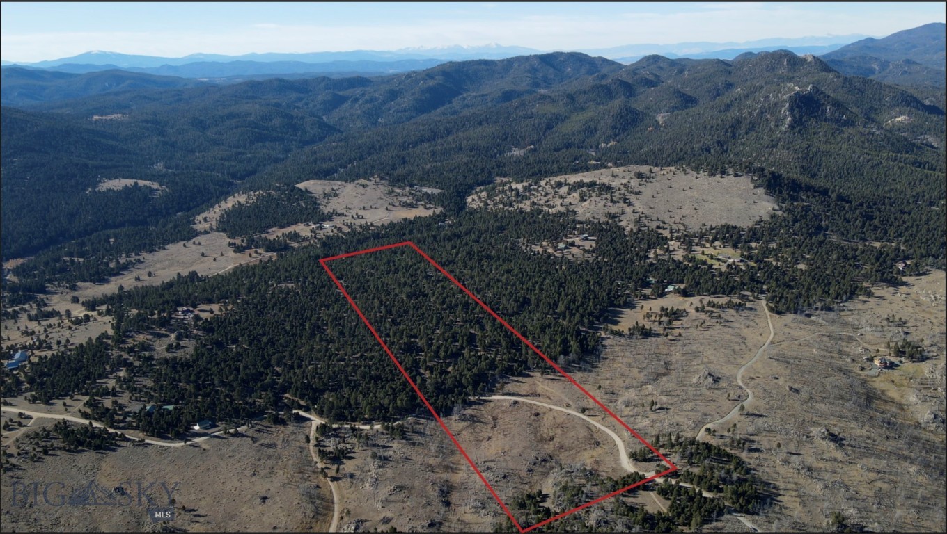 Build your dream country home on this 40-acre parcel that is beautifully landscaped by Mother Nature with immense boulder outcroppings, trees, natural grasses, flowers and magnificent views of the Tobacco Root Mountain Range.  This area is rich in recreation, scenery, trail systems, wildlife. Slow down, relax and enjoy the special lifestyle that comes with the beautiful surroundings, tranquility and recreational opportunities. Conveniently located about halfway between Butte and Whitehall off Highway 2. Good, year-round access.  The property includes a cozy tiny house (approximately 200 square feet) with a well and electric.  (Check out the aerial video attached to this listing).