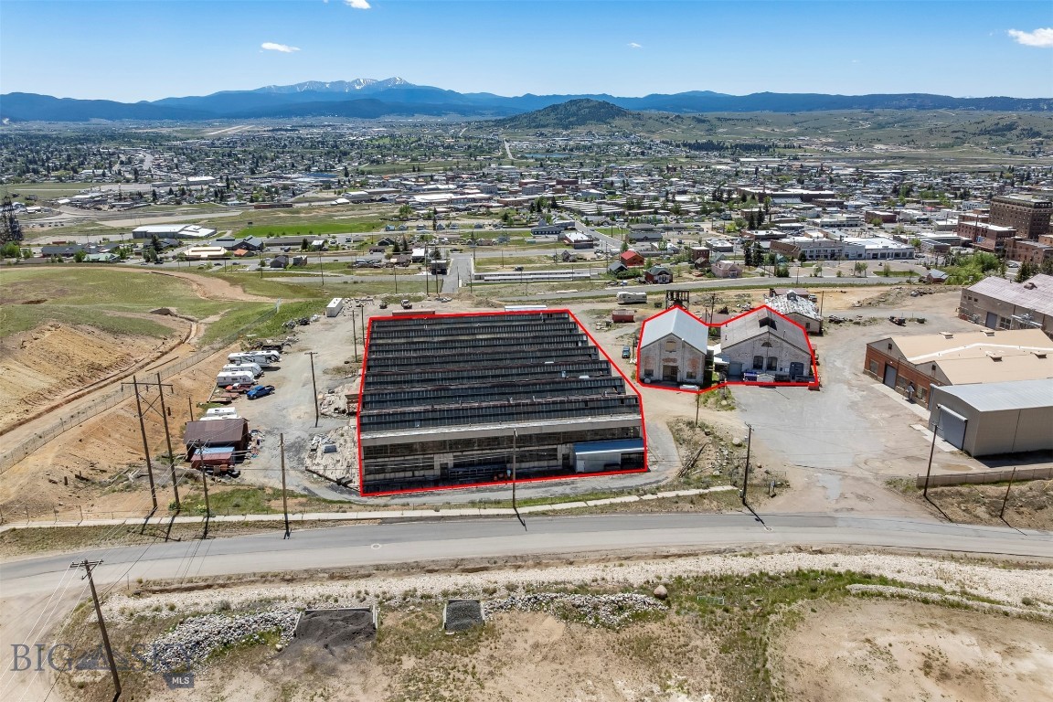 Unique commercial opportunity featuring three buildings totaling approximately 39,000 square feet. Sale includes buildings only; land is leased through the county. The main building offers approximately 3,500 sq ft of office space with a kitchen, bathroom, conference area, loft storage, and a roof installed approximately 10–15 years ago. The second building includes approximately 4,000 sq ft on two levels, featuring commercial space with concrete floors, office areas, storage, and a bathroom. The third building is approximately 31,500 sq ft industrial structure formerly used for locomotive servicing, with overhead cranes, loft space, two bathrooms, and extensive storage/workspace potential. Water service is available. Endless possibilities for the right buyer.  
*Buyers to verify square footage*