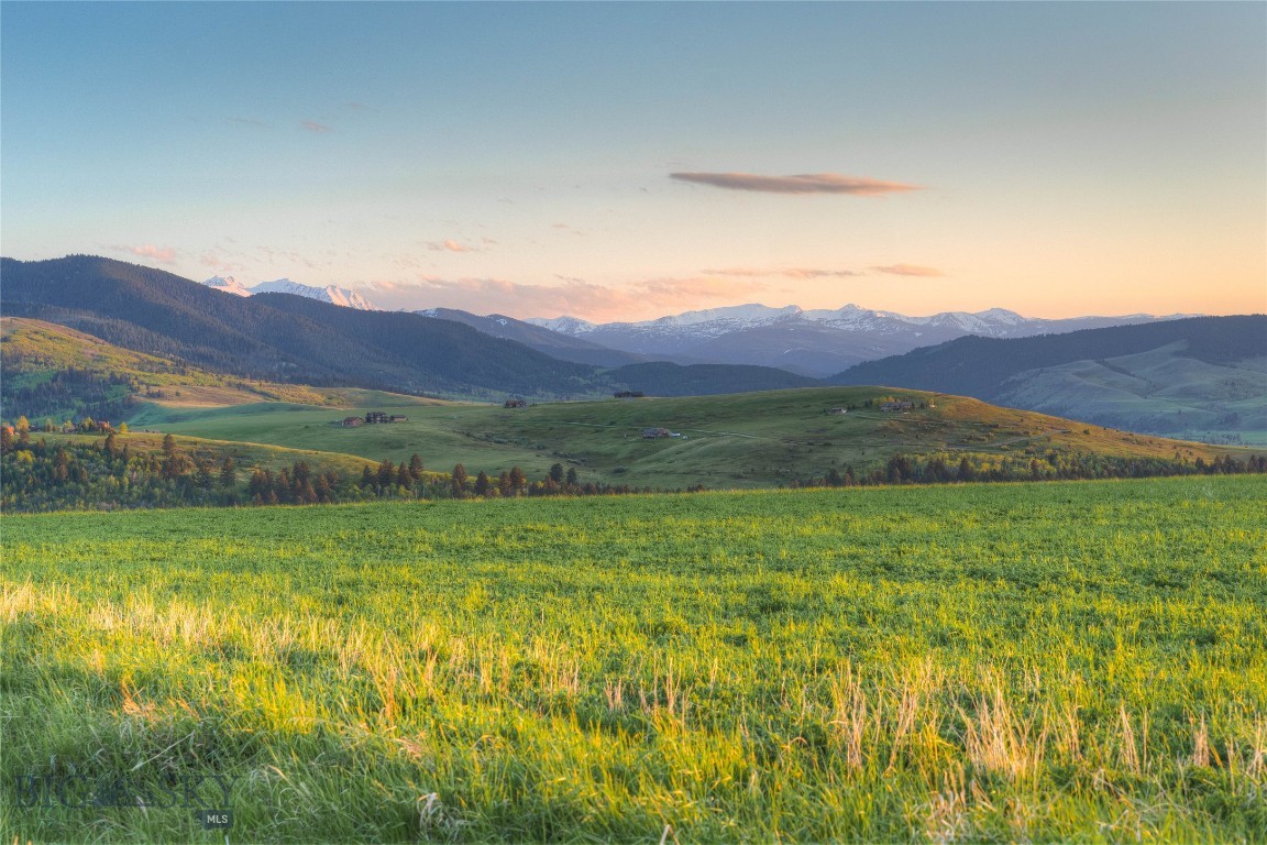 Welcome to one of the most stunning parcels in the exclusive, gated 7 Ranges community — a peaceful enclave perfectly positioned between Bozeman and Big Sky. This exceptional lot offers 360-degree views of the Gallatin Valley and the surrounding mountain ranges, creating an awe-inspiring backdrop for your Montana dream home.

Nestled in a serene and scenic setting, this acreage is a haven for wildlife and outdoor enthusiasts alike. The upper portion of the property is relatively level, providing multiple easy-access building sites. Meanwhile, the southern section gently slopes, offering enhanced privacy from neighboring parcels.

Conveniently located just a few miles from Little Bear Forest Service access, this property is your gateway to countless recreational opportunities — from hiking and horseback riding to backcountry adventures. Whether you're seeking proximity to the vibrant culture and amenities of Bozeman, or the world-class skiing, fishing, and wilderness of Big Sky and the Greater Yellowstone region, this location delivers the best of both worlds.

Don’t miss this rare opportunity to own a premium lot in one of Montana’s most picturesque and private communities.