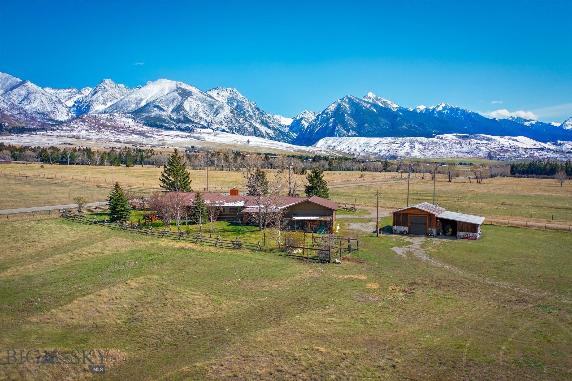 Some say the north east section of Paradise Valley is the most beautiful place in the world: the Absarokas towering to the east, the Gallatins rolling to the west and in between, the fabled big sky. Sited on nearly 3.5 acres, this spacious 4-bedroom, 3-bath property sits among historic ranch land with dramatic views from every window.  A comfortable, well-loved home with simple grace and quiet charm, it’s move-in ready yet offers excellent potential for updating and streamlining. There's a huge living room, spacious kitchen, separate office space/guest suite and loads of great storage throughout. The attached garage is oversized, with a heated workspace/room; the 21' x 31' barn has a wood stove, high ceilings, big windows, ideal for toys or hobbies. Situated just off East River Road and fifteen minutes from the old western town of Livingston, the property is an hour from Yellowstone National Park. World class blue ribbon trout fishing is right next door at Nelson's Spring Creeks, trail heads are close by. I90 is minutes away, with the university town of Bozeman and it's international airport a 30 minute drive. While many people now own property in Montana, few are able to buy right here, so seldom do homes come on the market. Whether you’re looking for a full-time home, a legacy property or a weekend retreat, this is a rare, once-in-a-lifetime Paradise Valley opportunity. Call now for an appointment to view!