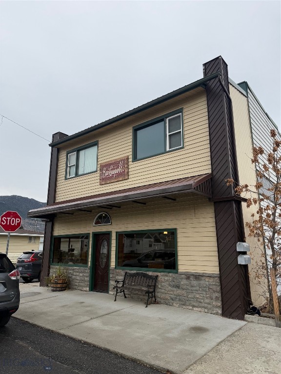 Commercial and residential combined use building on intersection of Floral Blvd and Sheridan Ave. Building has 1568 square feet on each floor with the main floor currently used as a beauty salon with booth rental. Eleven booths along with 2 extra rooms, bathroom, laundry room and efficiency kitchen make up the space which has potential for conversion to other business types such as a workout facility or duplex. With each level having 1568 square feet, the building has great potential for a "live-work" facility.  The second floor is a three bedroom, one bath apartment with remodeled kitchen and bath. Rooms in the apartment are very large and there is an open floor plan . Upgrades include stairway of trex and steel railing with a small deck. A copper back splash frames the kitchen counter top. Updated siding and rubber roofing complete these exterior upgrades along with a private parking lot on the west side of the building. A garage with an overhead door and storage up and down completes the amenities.