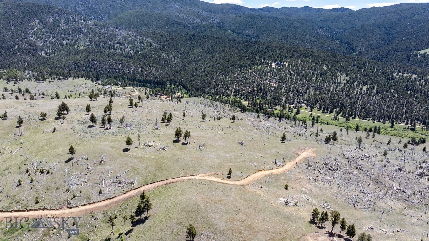 Set against the backdrop of Montana's rolling hills and big skies, this scenic 20-acre parcel near Boulder offers the perfect balance of privacy, natural beauty, and outdoor opportunity. Gently rolling meadows, rugged hillsides, striking rock formations, and panoramic views create a landscape that captures the essence of Montana living. Situated near the National Forest, this property provides convenient access to countless recreational opportunities, from hiking and hunting to exploring the surrounding mountains and public lands. Located within Hunting District 380, known for its special draw bull tag, the area is rich with wildlife. Elk, mule deer, and whitetail deer are regularly seen throughout the property, making it an ideal setting for nature enthusiasts and sportsmen alike. Whether you're looking for a future homesite, a seasonal getaway, or a place to invest in Montana land, this parcel offers the space and freedom to create something truly your own. The diverse terrain provides multiple possibilities for building, recreation, and enjoying the peaceful surroundings. An added benefit is the neighboring 20-acre parcel (MLS 30073161), which is also available for purchase. Together, the two properties offer a unique opportunity to own 40 contiguous acres with exceptional views, abundant wildlife, and room to explore. Opportunities like this are becoming increasingly difficult to find in Montana's growing market.