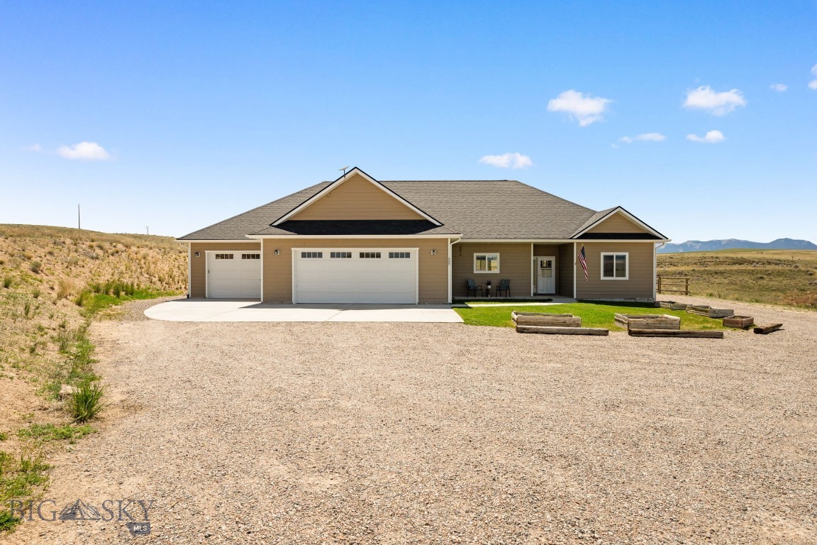 Built in 2022 and situated on approximately 4 acres in Sweetwater Estates Subdivision, this 3-bedroom, 2-bath home offers 1,794 square feet of comfortable living space with room to enjoy rural living and expansive mountain views just minutes from Dillon. The thoughtfully designed kitchen features rich dark walnut cabinetry, granite countertops, stainless steel appliances, abundant storage space, and an added pantry area.

The inviting living area is complemented by a wood stove, while a gas forced-air furnace and central air conditioning provide year-round comfort. The spacious primary suite includes a sliding glass door leading directly to the backyard, along with a well-appointed en suite bath featuring a soaking tub for relaxation, a large vanity with generous counter space, and dual sinks.

The guest bedrooms offer double-door closets and beautiful mountain views. One guest bedroom features a built-in bunk-style bed, turning every night into an adventure.

An impressive approximately 1,318-square-foot finished garage provides plenty of room for vehicles, equipment, and hobbies, with an extra-deep third bay offering additional flexibility. Outside, the backyard provides a blank slate to make it your own. With a concrete patio area and fenced yard already completed, the remaining space is ready to customize and create the outdoor setting you've envisioned while taking in the surrounding mountain scenery.
If you've been searching for a newer home with acreage, mountain views and space to make your own, this Sweetwater Estates property presents a wonderful opportunity close to Dillon.
