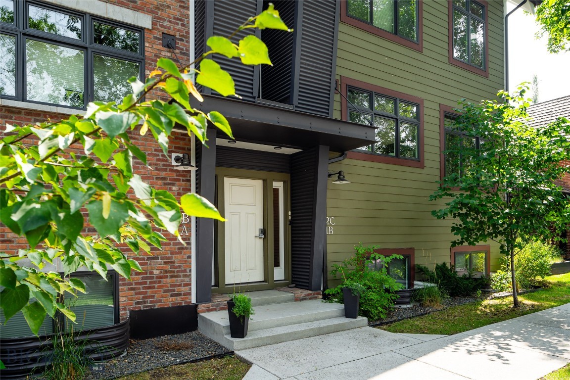 Lock it. Leave it. Love it!

One of Bozeman’s best in-town addresses. This Hawthorne Place condo by architect Frank Cikan delivers the best of downtown living without the noise. His thoughtful modern reverse floor plan elevates the living spaces for a tree-house-like view, spanning two levels and ~2,020 sq ft with 3 bedrooms (one converted into a fully built-out office), 2.5 baths, and finishes that feel intentional: white oak floors, quartz counters, GE Café appliances, and 9' ceilings on the main level. A covered balcony and heated tile floors in the lower-level bathrooms add the everyday comfort that makes a home easy to love. The lower level offers a private primary suite plus two additional bedrooms, while dual-zone heat and A/C with Wi-Fi thermostats keep things dialed in year-round.

One block from Main Street, enjoy a front-row seat to downtown Bozeman in a peaceful yet vibrant location. If low-maintenance living appeals, this home checks all the boxes. Fully furnished and turnkey right down to the silverware in the drawers and sheets on the beds. Quality proven management is already in place, just push the easy button. A detached heated garage and HOA-covered exterior maintenance, snow removal, and landscaping mean low overhead and minimal hassle.

As a bonus, this property could legally help pay for itself while you’re gone with Type 2A short-term rental licensing available as a primary residence (owner not required on-site during rental periods) in B3 zoning. Buy it and use it on your terms, and let it work in between. The operational foundation is already in place, this is a true turnkey opportunity in one of Bozeman’s most walkable in-town locations. Steps from everything downtown has to offer.