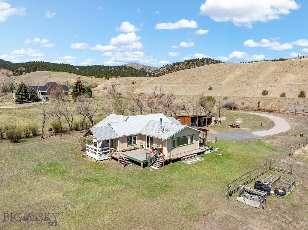 Little Pipestone Creek flows through this private 4.94-acre Montana homestead featuring a barn, chicken coop, greenhouse, mature trees, and a beautifully updated farmhouse—just minutes from Whitehall.
If you’ve been dreaming of a property where you can garden, raise animals, enjoy fresh eggs, and unwind to the sound of a year-round creek, this is it. The charming home has been thoughtfully updated while maintaining its country character, creating a warm and inviting space to gather with family and friends.  Outside, the possibilities are endless. Whether you’re looking for a hobby farm, horse property, homestead, or simply a peaceful retreat, you’ll appreciate the barn and abundant space to enjoy the Montana lifestyle. Mature trees provide privacy and shade, while Little Pipestone Creek adds beauty, tranquility, and a setting that’s increasingly hard to find.  Located just a short drive from Whitehall and within easy reach of Butte, Helena, and Bozeman, this property offers the perfect balance of rural living and modern convenience. Bring your animals, your gardening gloves, and your Montana dreams—967 MT Highway 2 W is ready to welcome you home!