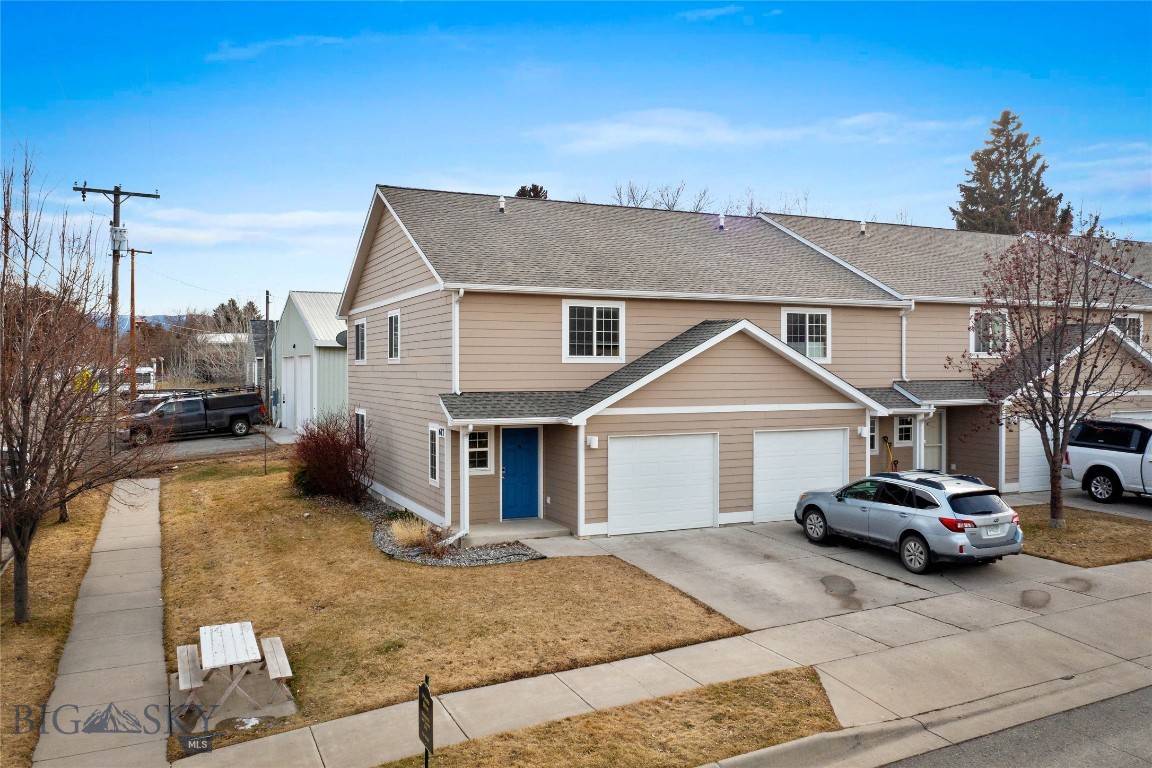 End-unit condo, which is move-in ready for new owners and walking distance to downtown Bozeman!

The main level features an open-concept kitchen, dining, and living area with hardwood and slate flooring, as well as a half bath and an oversized one-car garage. The second level includes freshly shampooed carpets throughout, a primary suite with a 3/4 bath and walk-in closet, two additional bedrooms, full bath, and a laundry area.