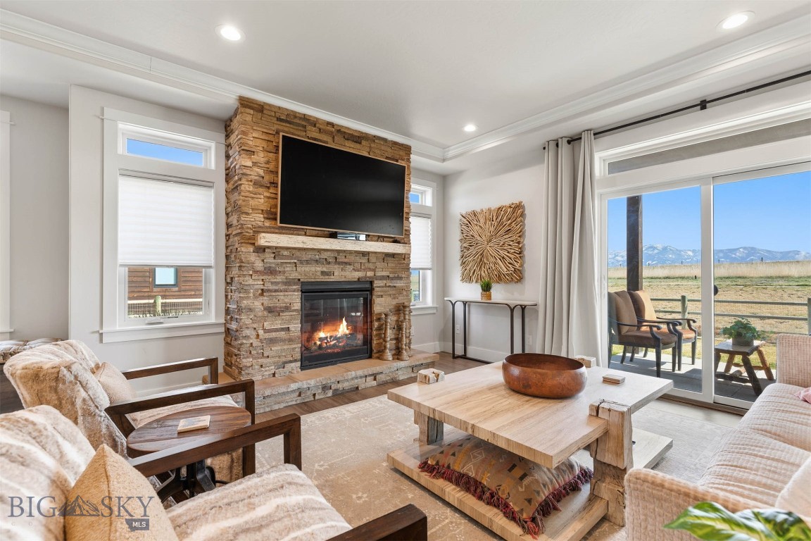 Welcome to an exceptional residence in the coveted White Horse Ranch community, where modern luxury meets Montana’s breathtaking landscape. Built in 2022, this thoughtfully designed 2,532-square-foot home offers an ideal blend of sophistication and functionality, featuring four spacious bedrooms, two beautifully appointed bathrooms, a dedicated home office or flex space, and an expansive upstairs bonus room perfect for recreation or relaxation.

The heart of the home showcases a seamless open-concept design, with a refined kitchen, dining, and living area adorned with contemporary finishes, a generous walk-in pantry, and large windows framing views of the Bridger Mountains and providing the home with abundant natural light. The main-level primary suite provides a private retreat with a well-appointed ensuite bath, while two additional guest bedrooms and additional full bath on the main level offer comfort and privacy for family or visitors. A practical yet stylish laundry and mudroom supports an active Montana lifestyle, and air conditioning ensures year-round comfort.

Upstairs, you’ll find a versatile bonus room along with a private fourth bedroom and full bathroom—ideal for guests, a secondary suite, or a secluded retreat.

Step outside to a large, covered patio, perfectly positioned to capture unobstructed views of the Bridger Mountains—an idyllic setting for entertaining or quiet evenings. The oversized three-car garage provides ample space for vehicles and outdoor gear.

Situated just outside of Bozeman, with convenient access to Four Corners, Belgrade and Big Sky, this home offers both tranquility and connectivity. White Horse Ranch enhances the living experience with over 16 acres of parkland and open space, scenic walking trails, ponds, and community amenities including a basketball court and pickleball court. This is a rare opportunity to enjoy refined living in one of the Gallatin Valley’s most desirable neighborhoods.