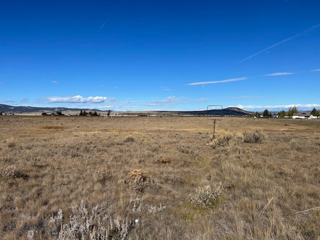 A rare and exceptional offering for developers and builders! Secure this expansive 12.98-acre parcel (Tract 1) on the desirable Terra Verde Drive. With R-1S (One-Family Suburban Residential) zoning, this property provides the potential for a high-yield, single-family residential subdivision. Or this parcel would work perfectly for the single user who wants space and privacy. The scale and desirable location make this one of the most attractive development opportunities in the Butte market today.