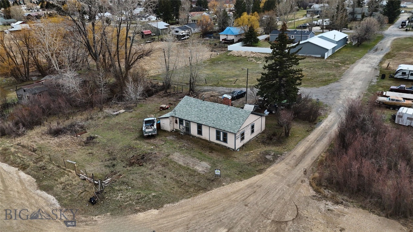 This long-held family home features 2 bedrooms, 1 bathroom, and approximately 1,221 sq ft on a 10,585 sq ft lot. The property is not financeable and is not currently connected to city sewer, though a new city water line has been installed. With its central location, mature trees, and private setting, this property offers strong potential for an investor.
