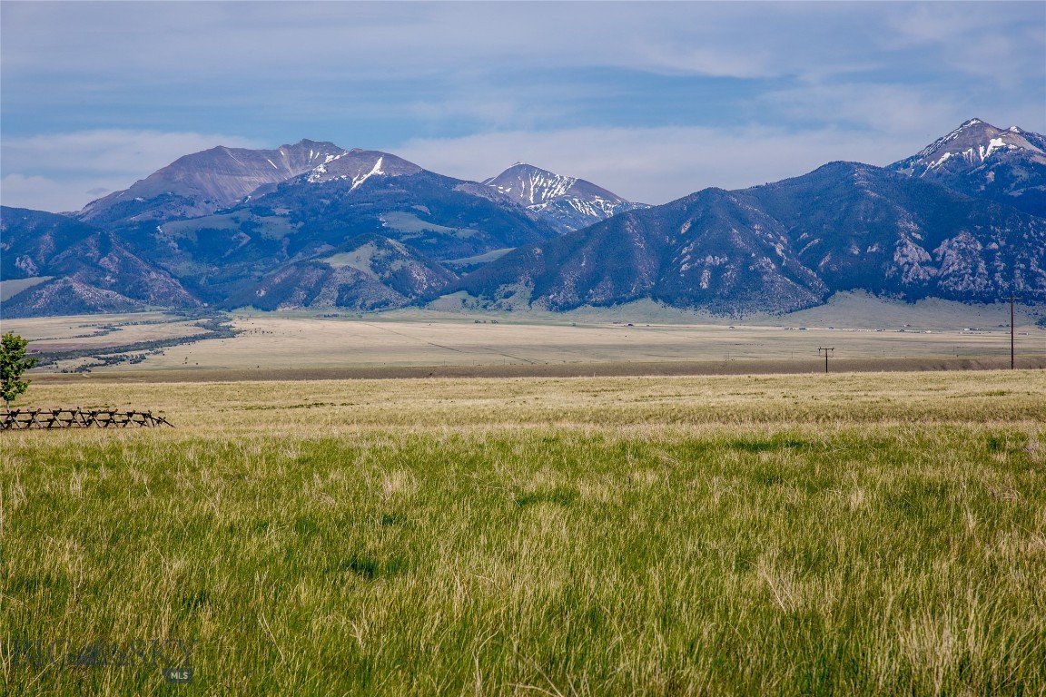 Set against a protected ranch under conservation easement, this 7.4± acre parcel is arguably one of the most desirable in Pronghorn Meadows. The lot offers unobstructed views of the Madison Range and is located adjacent to a wildlife corridor—frequent antelope sightings make this property truly special.
The land is level, build-ready, comes with DEQ approval, fiber optics already to the lot, and power is available in the area. Pronghorn Meadows is a thoughtfully planned community with lot sizes ranging from 1 to 20 acres and covenants that protect long-term value. Amenities include a community equestrian facility—ideal for boarding your horse at a minimal cost—and a clubhouse available for private events and mail services.
Located just 10 minutes from Ennis, this property provides access to all the beauty and recreation of the Madison Valley. The world-renowned Madison River, a blue-ribbon trout fishery, is minutes away, and Bozeman and Yellowstone National Park are each about an hour’s drive. A rare opportunity to own a prime piece of Montana in a well-established development