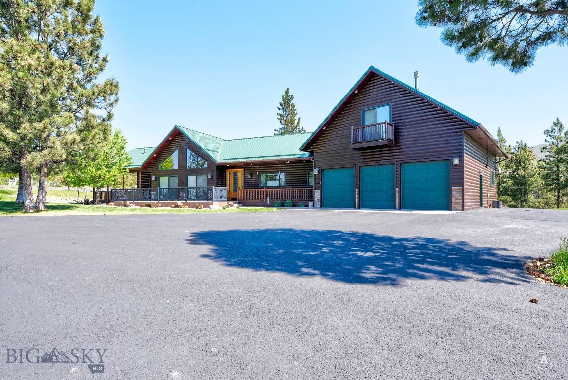4100 Starwood Court offers the kind of Montana living that feels both refined and deeply rooted in the landscape around it. Perched above Helena with breathtaking views of Canyon Ferry Lake and Big Belt mountains, this custom home blends rustic character, thoughtful craftsmanship, and exceptional functionality into one unforgettable property. From the moment you step through the massive custom entry door, you’re welcomed by warm finishes, vaulted ceilings, expansive windows, 5 fireplaces and stunning natural light that frames the lake and mountain views beyond. Granite surfaces, log siding details, and rich textures throughout the home create a timeless Montana feel while still offering comfort and elegance. The spacious main living area was designed for gathering and taking in the scenery, while the home’s flexible layout offers 4 bedrooms, a dedicated office, workout room and a formal dining room ideal for entertaining or hosting holidays with family and friends. An impressive addition creates even more versatility with its own private living area, bedroom, and additional lake-view spaces - perfect for guests, multigenerational living, or a peaceful retreat of its own. Practicality meets beauty throughout the property with an incredible amount of storage around every corner. From oversized storage areas to additional basement storage spaces, this home was designed with everyday living in mind. The meticulous garage is a standout feature on its own, offering exceptional organization and workspace potential, plus convenient RV electrical hookups for added flexibility. Whether you’re enjoying quiet mornings overlooking Canyon Ferry Lake from the gorgeous deck with custom railing, working from home surrounded by Montana beauty, or hosting loved ones in the heart of the home, this home captures the comfort, craftsmanship, and lifestyle that make Montana living so special.