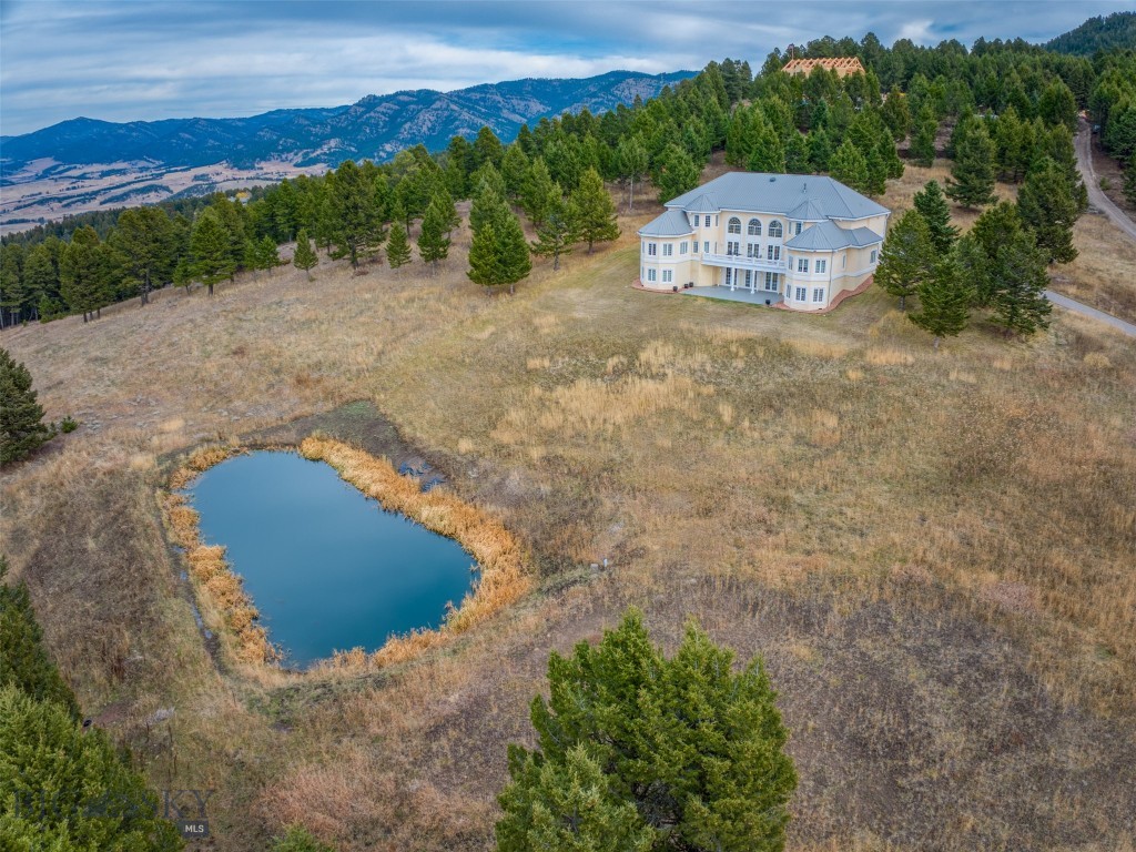 Experience Montana living at its most breathtaking. Set on nearly 40 acres in the heart of Bridger Canyon, the John B Scholz designed home is truly remarkable Castle in the Woods.  This truly unique space has been thoughtfully positioned to take in some of the most remarkable views from nearly every window.

Built by a longtime commercial developer, using many of the techniques and processes that we see in commercial construction.  The primarily steel and concrete construction with fireproof German stucco provides peace of mind while living in the wildfire urban interface and creating an incredible canvas to suit your plans for decades to come.  The largely freespan design allows for interior modification without be encumbered by load bearing walls.  The residence has in-floor heating, triple-pane windows, and soaring ceilings that invite in natural light.  Over engineered and designed mechanicals provide redundant heating options as well suitable backup.

A great year round road leads up this incredibly sought after homesite.  Boasting an abundance of wildlife, from elk, fox, deer, bear, eagles, turkey, you'll find you are never lonely while in superb seclusion just a short drive from downtown Bozeman and Bridger Bowl ski area.  Trails wind through the meadows and timberstands of this amazing and rare property so you can enjoy every bit of what it has to offer.

This is more than a home — it’s a sanctuary of privacy and Montana beauty and ready for both your and its next chapter.