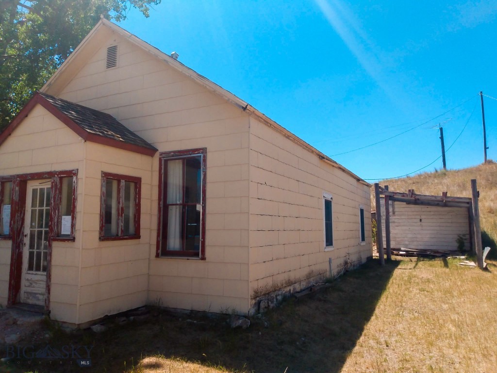 Escape the crowds and discover your own slice of Southwest Montana! Located off the beaten path in the quiet, historic mining town of Radersburg, this charming 2 bed, 1 bath home is bursting with untamed potential. Built in 1885, this home offers the perfect blank canvas for an investor, DIY enthusiast, or outdoor lover looking to fix it up and make it exactly their own. Selling as is, this property presents a rare buyer opportunity to breathe new life into a piece of Montana history. Set on a quarter acre lot featuring a lovely shade tree, gardening area, and a handy storage shed, the property comes equipped with essential updates to get you started—including a brand-new water heater, plus a private well and septic system already in place. If you live for recreation, this location is absolutely unbeatable. You are mere minutes from endless public lands, including vast BLM access and the majestic Helena-Lewis and Clark National Forest. The Elkhorn Mountains are practically in your backyard, offering big game hunting, hiking, and miles of trails for your recreational side-by-side adventures. Prefer to spend your weekends on the water? You are just a quick 9-mile paved drive back to Highway 287, right where it crosses the mighty Missouri River, providing fantastic boat access and blue-ribbon trout fishing. Another 15 minutes from there will get you to Canyon Ferry Lake for lake fishing, water skiing, wake boarding, and much more. Whether you're looking for a peaceful year-round retreat, a seasonal hunting cabin, or a rewarding renovation project away from the hustle and bustle, 313 Main St is your gateway to the authentic Montana lifestyle. Bring your tools, your toys, and your vision!
