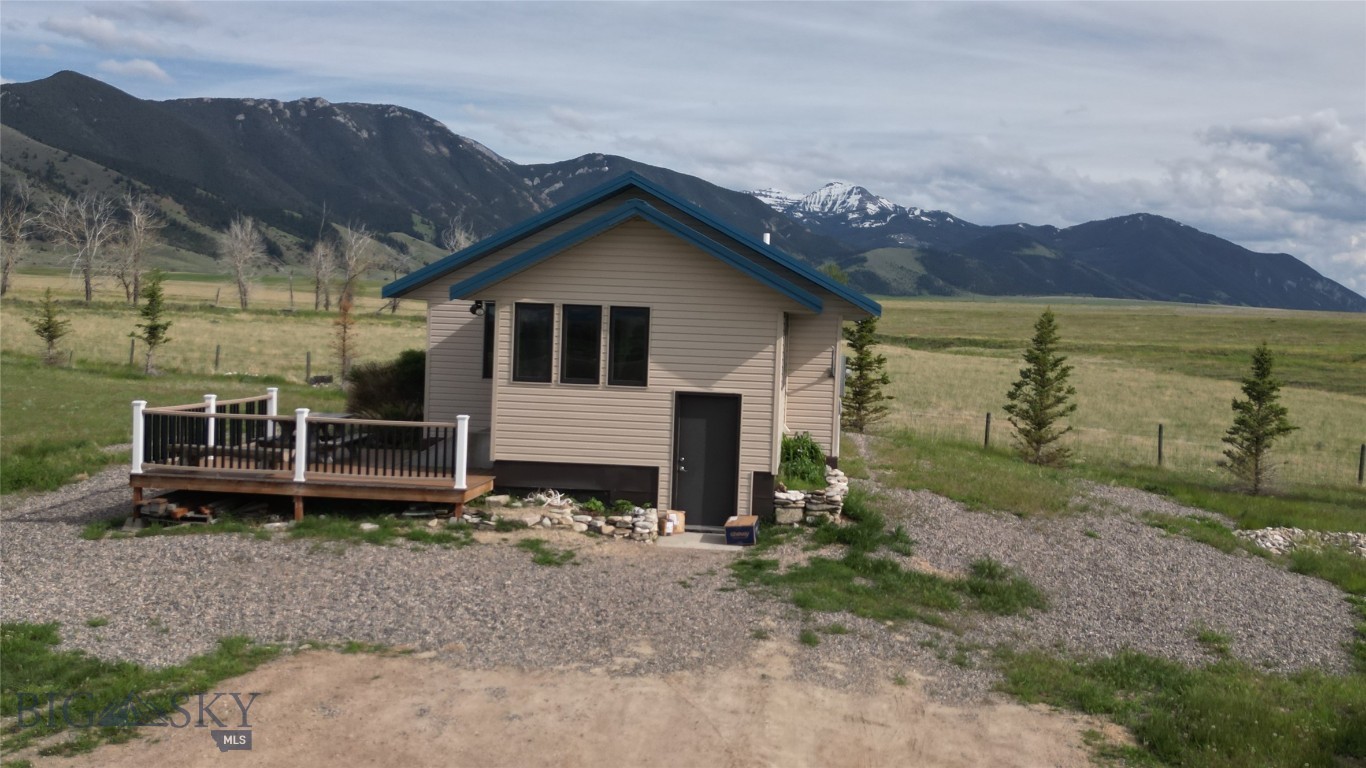 Unrivaled views of 5 mountain ranges & Ennis Lake from this hilltop location. Sit on the 200 SF Trex deck & take in the views. This 1 bedroom, 1 bath cabin is located between Ennis & Big Sky off of Jack Creek Road. Approximately 22 miles to the base area of Big Sky for skiing & other recreation with a road pass. Bathroom & kitchen have tile floors. 500 gallon buried propane tank with efficient Rennai heating unit, plus electric baseboard heat. Newer Jen-Air stove, fridge, washer & dryer. 50 gallon water tank with new element & thermostat. Easy to winterize. Partially
landscaped. The well is 217 feet with 15 gpm. Plenty of room on this 4.89+/- acres to build your dream home, garage or add on to the cabin.