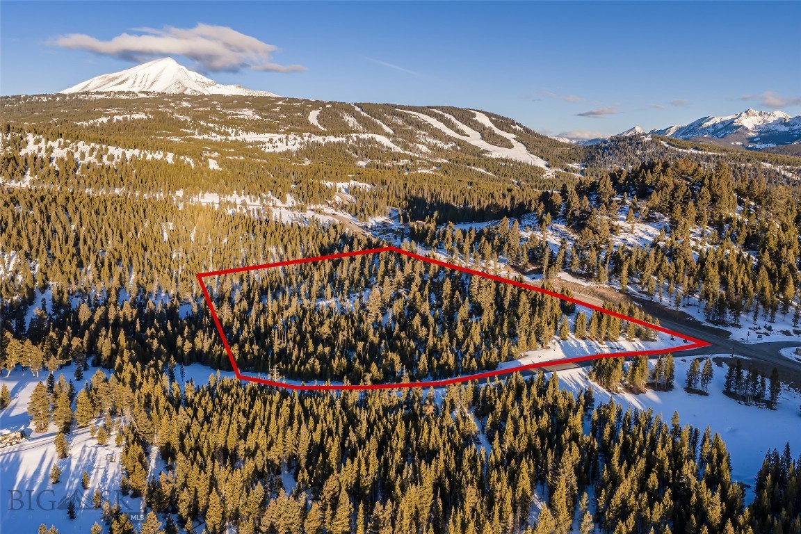 Discover the perfect balance of privacy, mountain beauty, and world-class amenities with this rare 5.87-acre homesite in Seclusion Point at Spanish Peaks Mountain Club. Tucked into a quiet enclave with breathtaking views of Lone Peak and surrounding wilderness, this property offers the ideal setting for your Montana dream home.
Perched on an expansive lot, Lot 157 provides ample space for a custom residence that captures panoramic mountain vistas and maximizes year-round outdoor living. Mature pines and open meadows create both seclusion and connection to nature, while the property’s elevated position ensures dramatic sunrise and sunset views.
Ownership includes the option of a Golf Membership at Spanish Peaks Mountain Club, granting access to the award-winning Tom Weiskopf-designed golf course, clubhouse, dining, and exclusive member amenities. In winter, enjoy direct access to Big Sky Resort’s legendary skiing through the club’s private trails and ski-in/ski-out opportunities.
With nearly six acres of pristine Montana landscape and direct ties to one of the region’s premier private communities, Lot 157 at Seclusion Point is a legacy property offering both sanctuary and adventure.