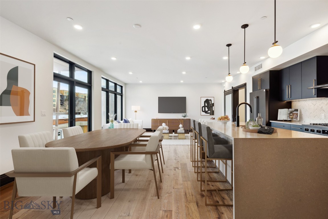 The Henry, a six-story luxury condominium building in Downtown Bozeman, #406 has a bright and airy feel to it. Sitting on over 1,301 SF with one bedroom, plus den, two bathrooms, and a 122+- sf heated balcony, this unit has it all. With engineered oak hardwood floors, wool carpeting, quartz countertops and Bosch appliances to go with high-end fixtures and tons of natural light, this condo is a ready-made luxury offering in the heart of the Rocky Mountains’ coolest town. And it doesn’t stop there - The Henry building has amenities that make it more than just a residence: a ground floor fitness center, a private, landscaped courtyard and climate-controlled, secure underground parking. Just three blocks from Main Street, twenty-five minutes to Bridger Bowl and forty-five minutes to Big Sky Resort, you'll have easy access to the vibrant downtown scene, outdoor recreational activities, and Montana's stunning natural landscapes.