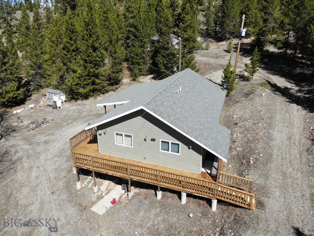Nestled in the heart of nature's paradise, 95 Little Moose Creek presents a modern 2-bedroom, 1-bathroom home boasting unparalleled tranquility and convenience. Imagine a life surrounded by 40 sprawling acres where elk, deer, moose, and other wildlife roam freely. Enjoy breathtaking views from every window, revel in the seclusion, and unwind by the tranquil ponds. This property seamlessly blends modern living with rustic charm, featuring forced air heat and a cozy propane fireplace for backup. Stay connected with fiber optics and a traditional telephone landline while enjoying the convenience of reliable power already to the home. Beyond the property line, adventure awaits! Two sides border the vast forest service land, making it a haven for hunting and fishing enthusiasts. In the winter, embrace the thrill of snowmobiling or head to the nearby ski area for a day on the slopes. This is more than a home; it's a lifestyle. Escape and discover your sanctuary at 95 Little Moose Creek.