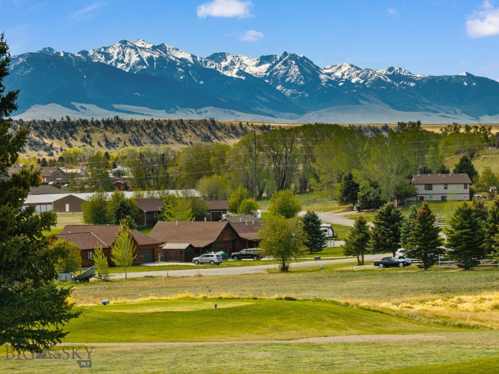 Discover the perfect setting for your Montana dream home on this exceptional .928± acre homesite located on Hilgard Court in the sought-after Valley Garden Golf Village in Ennis, Montana. Nestled alongside the golf course and surrounded by breathtaking mountain vistas, this property offers a rare opportunity to build in one of Southwest Montana’s most scenic and peaceful communities. From snowcapped peaks to rolling fairways and wide-open skies, the views in every direction capture the beauty that makes Ennis such a desirable destination. The spacious lot provides ample room to design and build the custom home you’ve always envisioned while still enjoying privacy, open space, and easy access to outdoor recreation. Positioned on the golf course with nearby paths, mature landscaping, and the tranquil setting of the valley, this property offers an ideal blend of recreation and relaxation. Whether you are looking for a full-time residence, seasonal retreat, or investment opportunity, the setting is truly hard to match. Located just minutes from downtown Ennis, you’ll enjoy convenient access to local dining, shopping, fishing on the world-famous Madison River, recreating at nearby Ennis Lake, and endless outdoor adventures including hiking, horseback riding, and hunting. With panoramic views, a premier golf course setting, and the charm of Ennis right at your doorstep, this is Montana living at its finest.