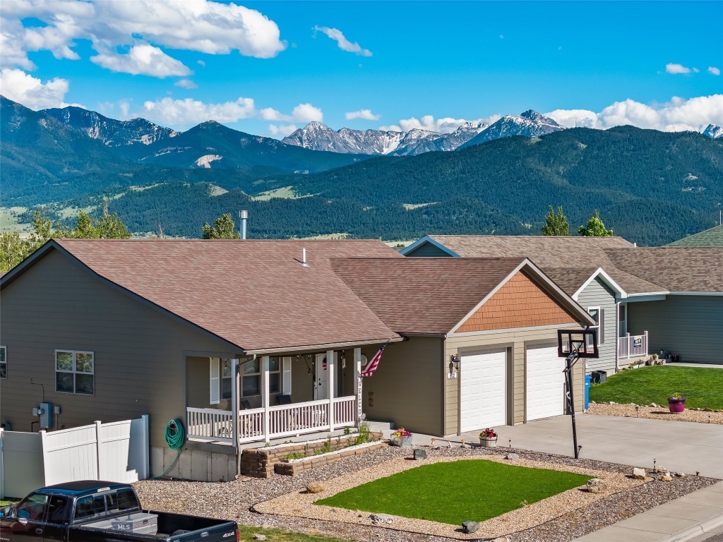 Welcome to 812 Pleiades Place in Livingston, Montana—a beautifully maintained 4-bedroom, 3-bath home offering 2,744± sq. ft. in one of Livingston's most desirable established neighborhoods. This thoughtfully designed property combines the convenience of main-level living with the versatility of a fully finished daylight basement. The main floor features an open-concept living room, kitchen, and dining area filled with natural light. The spacious primary suite includes an en-suite bath and walk-in closet, while an additional bedroom or office, full bath, laundry room, and attached two-car garage complete the main level. The finished daylight basement offers exceptional flexibility with a large gathering room, kitchenette/wet bar, recreation area, two additional bedrooms, full bath, and abundant storage. Ideal for guests, multi-generational living, hobbies, or entertaining.
Outside, enjoy play yard and mature landscaping designed for water conservation and a private backyard retreat. Chickens anyone? There is a chicken coop and shed! The home's orientation provides shelter from prevailing southwest winds and welcome shade during warm summer evenings.
Located near schools, parks, shopping, healthcare, and historic downtown Livingston, this move-in-ready home offers convenient access to the Yellowstone River, world-class fly fishing, hiking, skiing, Yellowstone National Park, and all the outdoor recreation Southwest Montana is known for. While you're searching for a Montana home, this one offers a versatile floor plan with generous living spaces, multiple gathering areas, and room to accommodate a variety of lifestyle needs. This one checks all the boxes, including comfort, functionality, and an outstanding Livingston location.