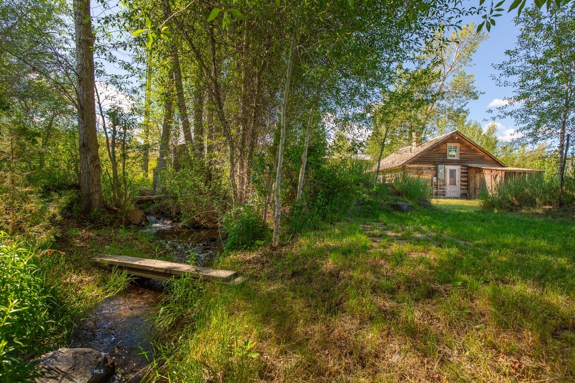 Own a rare piece of Gold Rush history with this authentic 1880 cabin, still standing on the exact location where it was originally built during the area's early mining days. Rich in character and historical significance, this unique property offers an opportunity to own one of the community's enduring landmarks while benefiting from valuable commercial zoning and exceptional natural features. The property consists of two city lots zoned Historic Viewshed Commercial District, providing flexibility for a variety of residential, commercial, tourism, or investment possibilities, subject to local regulations and approvals. Whether you envision a historic residence, boutique business, gallery, office, vacation rental, or mixed-use venture, the property's zoning and prime location offer tremendous potential. One of the most remarkable features is Daylight Creek, which flows through the lots. The year-round creek creates a peaceful setting with the soothing sound of running water, enhancing both the beauty and value of the property. The historic cabin reflects the craftsmanship and spirit of the late 1800s. As one of the few remaining structures from the Gold Mining era that remains on its original site, it offers a genuine connection to the region's past. Its rustic charm and authentic character make it appealing to history enthusiasts, preservationists, investors, and anyone seeking a property with a story to tell. The two-lot configuration provides additional space and flexibility not commonly found with historic properties. The combination of commercial zoning, creek frontage, and historical significance creates endless possibilities for future use while preserving the property's unique heritage. Located within a historic district, the property benefits from the charm, character, and appeal that attract residents and visitors alike. Properties with authentic historical roots and natural amenities become increasingly valuable and desirable. Whether you're looking for a historical cabin, an investment opportunity, or a unique commercial venture, this property delivers a rare combination of history, beauty, and potential. With an original 1880 cabin, two city lots with city services, Historic Viewshed Commercial District zoning, and Daylight Creek flowing through two parcels, this is truly a one-of-a-kind offering that captures the spirit of the Old West while providing opportunities for the future.