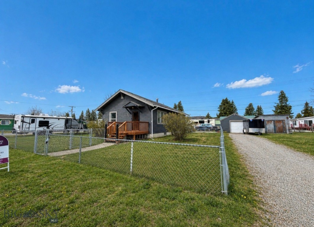 This 3 bedroom, 1 bathroom home is located on a spacious corner lot (over 9000 sf!) in a quiet, cozy neighborhood. The home has had many updates, including:
1. faux exposed beams in the open concept living room and kitchen, 
2.  new carpet (2020), 
3.  a full kitchen remodel  (2022), 
4.  new bedroom windows, fresh exterior paint and all new back deck (2023), 
5.  concrete patio between house and garage, plumbing (2024), 
6.  new interior trim and doors (2025),
7.  and brand new pavers leading up the the front door (2026). 
Walking in you will find yourself in an open living room and kitchen combination, filled with natural light and gorgeous cabinetry in the newly remodeled kitchen. The partially finished basement leaves open space for improvements of your choosing, while still maintaining functionality with an office space and out-of-the-way laundry. There is an insulated garage with a newer concrete pad inside, off street parking and room to park your camper and other toys, and a fully fenced (and cross fenced) yard for convenience! The hot tub now conveys! Seller is MOTIVATED, bring an offer!