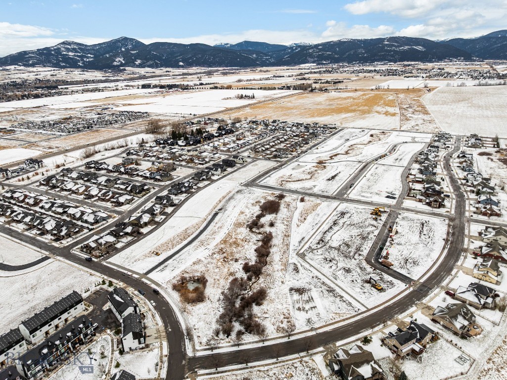Welcome to Meadow Bridge, Bozeman’s newest Southside neighborhood! This premier subdivision offers 45 fully entitled homesites ranging from 4,000 to 14,000 SF—ideal for your custom dream home. Enjoy stunning Bridger Mountain views, privacy, and direct access to open space and nearby parks. Conveniently located just minutes from Bozeman’s historic Main Street, with easy access to dining, shopping, and recreation. Close to top-rated schools and Montana State University. A rare opportunity to build in a quiet, close-knit community. Lot 7 offers ample space to design a custom home that fits your lifestyle—whether you envision a modern farmhouse or a spacious ranch-style home. This lot gives you the freedom to build exactly what you want. Bring your builder and make your dream home a reality in Meadow Bridge!