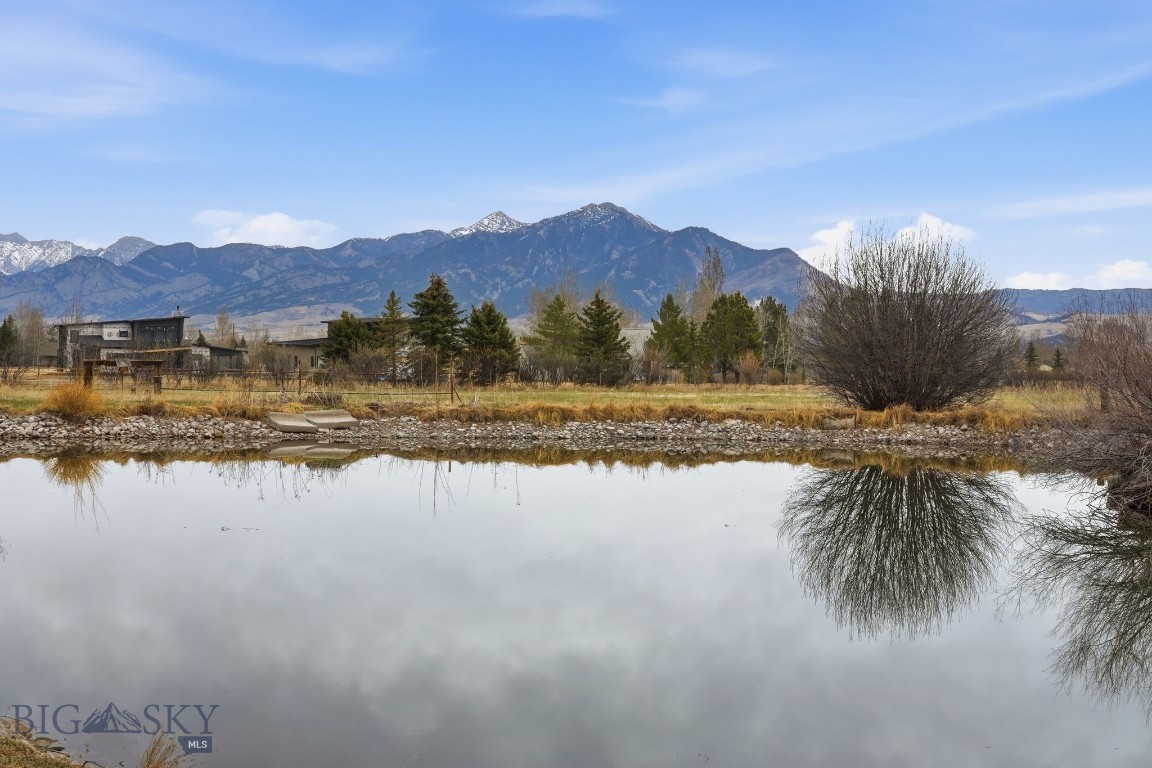 Prime 35± acre opportunity in Bozeman’s rapidly growing South 19th corridor—just south of Montana State University and only minutes to downtown Bozeman. This exceptional property offers a rare combination of location, flexibility, and existing infrastructure, making it well-suited for a range of uses from a private ranch setting to an investment hold or future development opportunity.

The land is currently utilized for hay production and generates additional income from an existing dwelling, creating both functionality and possible immediate revenue potential. Infrastructure is already in place with 4 septic systems, 2 wells—including a high-production irrigation well—and valuable water rights, offering a strong foundation for future improvements or expansion.

County zoned R-S (Residential Suburban) and free of covenants, this property provides flexibility that can be increasingly difficult to find in the Gallatin Valley. Enjoy sweeping views of the surrounding mountain ranges, abundant wildlife, and a peaceful pond nestled among mature trees close to the northwest corner of the property.

Ideally located near Hyalite Canyon and numerous trailheads, this property offers convenient access to some of the area’s most sought-after outdoor recreation while still maintaining close proximity to Bozeman’s amenities. Multiple access points via Bigelow Road, Cattle Drive, and Johnson Road further enhance usability and future potential.

A standout Gallatin Valley offering with location, versatility, and long-term upside. Buyer to verify all information to their satisfaction for intended use.