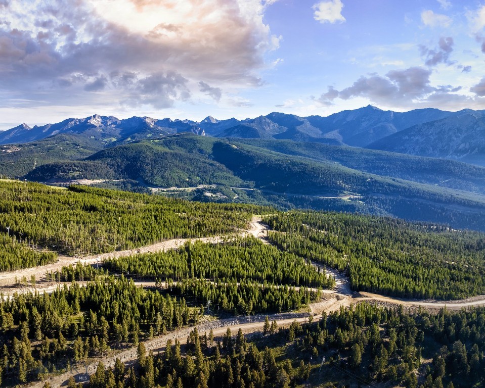 Discover Powdercrest, the final land release for custom-built homes within Spanish Peaks Mountain Club. This remarkable new neighborhood introduces 31 exceptional homesites—an exclusive opportunity to own among the last true ski-in, ski-out properties in one of Big Sky’s premier, members-only communities. Lot 31 is 5.04 acres, offering space, views, and an opportunity for amazing views.

Spanning the slopes of Flatiron Mountain, these generously sized parcels offer a rare balance of privacy, expansive views, and future direct lift access via a planned chairlift. Owners will step seamlessly onto the slopes of Big Sky Resort while enjoying a sense of space and seclusion seldom found in world-class alpine destinations.

Positioned along a dramatic ridgeline with unobstructed mountain panoramas, each homesite is thoughtfully sited to capture abundant natural light, jaw-dropping views, close trail access, and year-round outdoor living. Ownership includes access to an exceptional collection of current and future amenities, including dining, two Weiskopf-designed golf courses, the Spanish Peaks Clubhouse, Montage Big Sky, the highly anticipated Member Lodge Aspire, and an expanding ski network, all contributing to an already unmatched mountain lifestyle. Combined with close proximity to Big Sky’s vibrant Town Center and the untamed wilderness of Yellowstone National Park, this is truly an opportunity not to be missed.

Owners may choose between Social or Signature Golf membership at Spanish Peaks Mountain Club, joining an outdoor-focused community of like-minded mountain enthusiasts from around the world. To further streamline the path to ownership, buyers may also take advantage of the highly regarded Design Build Program.

This represents the final opportunity to create a custom legacy residence at the heart of Spanish Peaks—where world-class recreation, protected open space, and authentic alpine character define one of the most coveted addresses in Big Sky, Montana.
