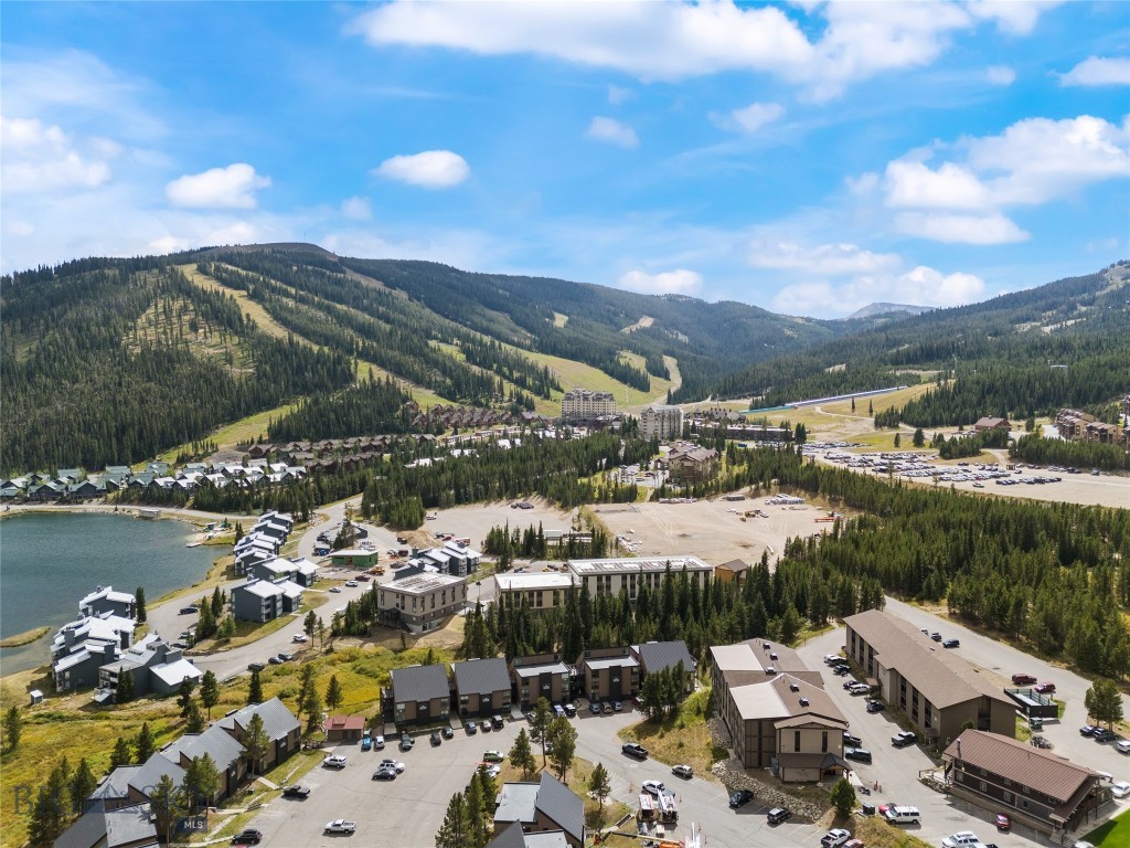 Enjoy this amazing opportunity to own a convenient ground floor Hill Condo with easy access to both ski lifts and bike trails right out your door. Perfectly positioned in the heart of Big Sky’s Mountain Village, this Hill Condo studio offers an ideal blend of convenience and alpine charm. Enjoy easy access to world-class skiing, dining, and year-round recreation just steps from your door. This efficiently designed space maximizes comfort with an open layout, making it a perfect basecamp for adventure or a low-maintenance investment property. Whether you're seeking a personal retreat or a rental opportunity, this studio delivers on location, lifestyle, and value.