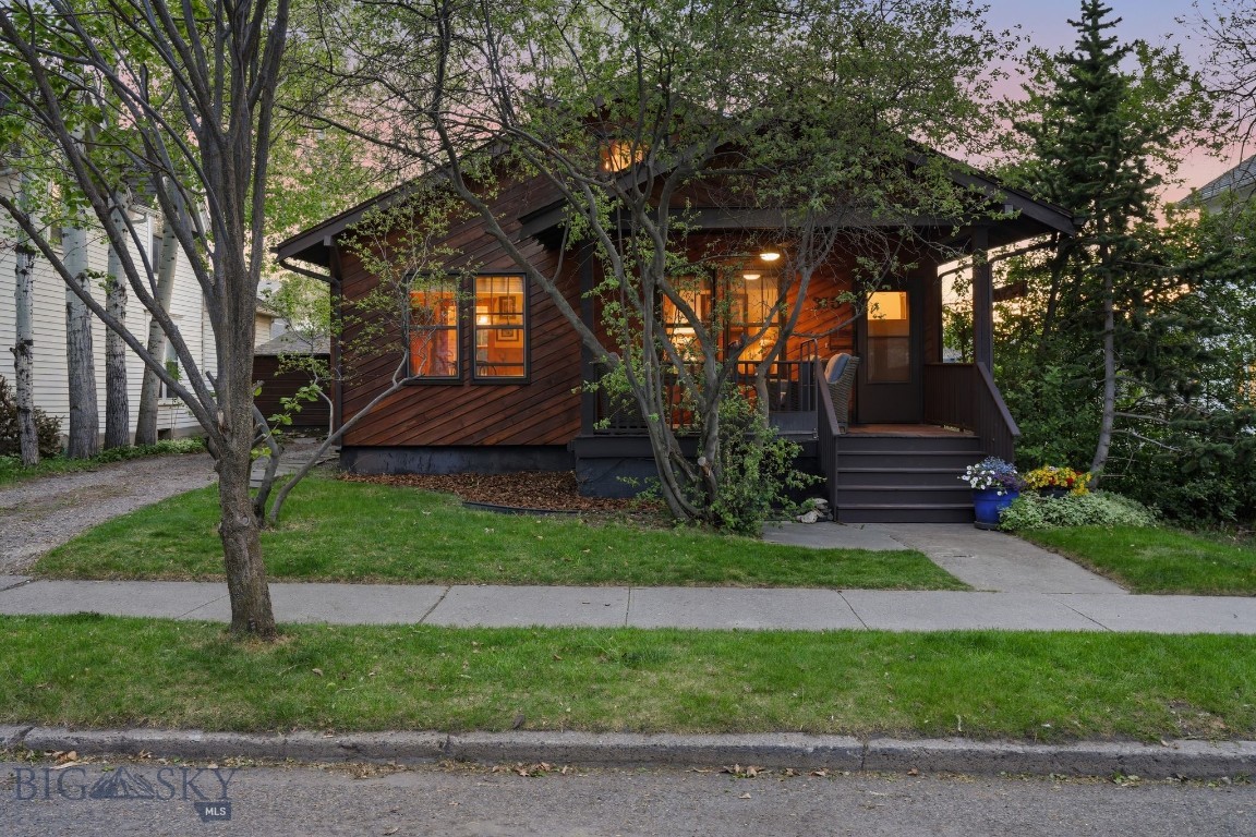 Iconic Bozeman character with more charm and wood detail than one could imagine. Set in a highly convenient northside location, this 1920 home offers a rare combination of warmth, craftsmanship, and in-town practicality. For buyers who appreciate natural materials, exposed wood, vaulted volume, and a home that does not feel like every other property on the market, this one stands apart.

The main level offers an inviting living room, dining area, kitchen, bedroom, bathroom, and covered porch (with wheel chair lift), creating a functional layout with everyday living spaces on one level. The living and dining areas are anchored by rich wood walls, dramatic ceiling detail, and a gas stove that adds to the home’s cozy, distinctive feel. The kitchen provides practical workspace, pantry storage, and connection to the main living areas.

Upstairs, the loft adds flexible bonus space for a guest area, office, reading nook, creative studio, or secondary living area. The basement includes additional room and laundry space, offering valuable storage and utility beyond the main living areas.

Outside, the property includes a landscaped yard, perimeter fencing, underground sprinklers, shed, and mature trees.  The location is equally compelling, with easy access to downtown Bozeman, Main Street, parks, sidewalks, and the incredible amenities of Bozeman’s Brewery District within a short distance. Enjoy nearby local breweries, dining, coffee, neighborhood services, and the energy of one of Bozeman’s most recognizable northside corridors without sacrificing the privacy and character of a standalone home.

Buyer and Buyer’s Agent to verify all information, including square footage, zoning, covenants, utilities, and property details. (NON-CONFORMING 2 BEDROOM HOME.  LOFT SPACE IS THROUGH MAIN LEVEL BEDROOM DOOR BUT COUNTED AS A SECOND BEDROOM.) PROPERTY IS BEING SOLD AS-IS.
