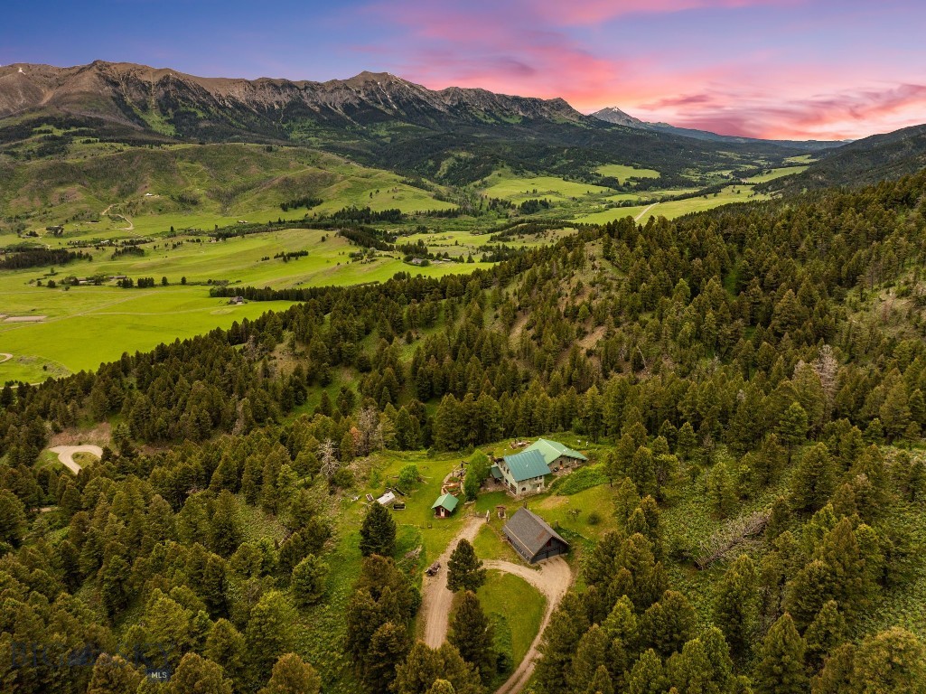 Tucked into the storied landscape of Bridger Canyon, Lennon Ranch offers a rare blend of privacy, space, accessibility, and panoramic views. Spanning nearly 135± acres and bordering 354± acres of state land, this custom retreat sits just minutes from both Bozeman and Bridger Bowl ski area. Here, sweeping meadows, rugged rock formations, and mature trees create a dynamic setting rich with wildlife and seasonal beauty. At its heart sits a very modest yet thoughtfully crafted 2,863± sq ft residence with three bedrooms, two full bathrooms, two half bathrooms, two kitchens, and multiple living areas. Dual primary suites on separate levels provide flexibility for hosting and everyday living. Lennon Ranch proves that location truly matters. Set within a landscape of sweeping mountain horizons and open valley views, it offers both tranquility and space. The rare combination of expansive acreage, direct access to state land, and proximity to Bozeman, Bridger Bowl, and world-class recreation creates a lifestyle few properties can match. Here, privacy is preserved without sacrificing convenience, offering the best of Montana in every direction.