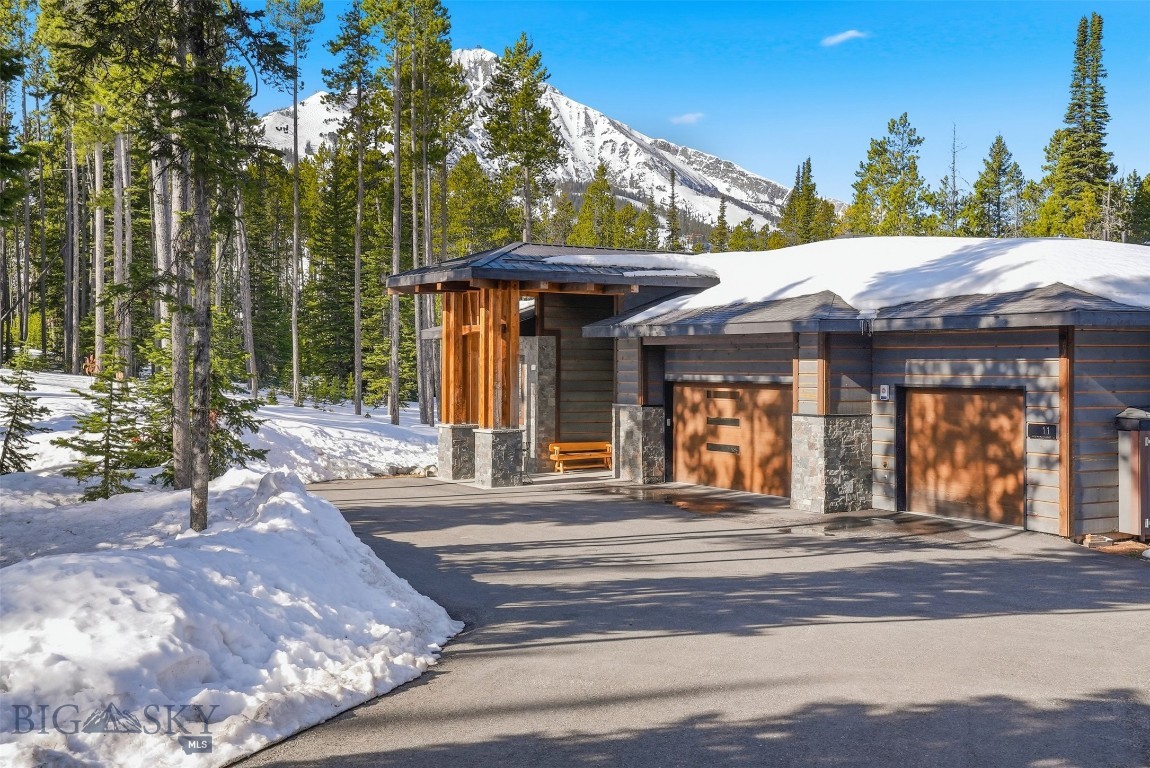 Mountain splendor and solitude with Lone Peak views!
Nestled in the Fir's, sets a spectacular 5 bedroom/5 bath mountain retreat.

Welcome to your dream alpine escape in the heart of Big Sky Mountain Village—where breathtaking mountain views, luxury finishes, and unmatched ski access come together to create the ultimate Montana lifestyle. This 5-bedroom, 5-bathroom residence offers over 4,400 square feet of refined living space designed for comfort, relaxation, and year-round adventure. Home is sold furnished.

Perched in a prime location with ski-in/ski-out access, this home delivers sweeping views of Lone Peak and the surrounding Spanish Peaks wilderness. Soaring ceilings and expansive windows bring the outdoors in, flooding the main living areas with natural light and framing the iconic landscape. Three inviting fireplaces—one in the great room, another in the primary suite, and a third in the lower-level lounge—add warmth and ambiance throughout.

The gourmet kitchen features high-end appliances, custom cabinetry, and a spacious island, perfect for hosting après-ski gatherings. Three bedrooms with en-suite bath, ensuring comfort and privacy for guests and family alike. The luxurious primary suite includes a spa-inspired bathroom, walk-in closet, and private balcony with panoramic views.

Additional highlights include a 3-car heated garage, large mudroom with ski storage, dog wash and a covered outdoor patio ideal for year-round enjoyment.

Whether you're seeking a full-time residence or an elite mountain getaway, this exceptional property offers the rare opportunity to own a slice of Big Sky paradise. Schedule your private showing today and experience mountain living at its finest.