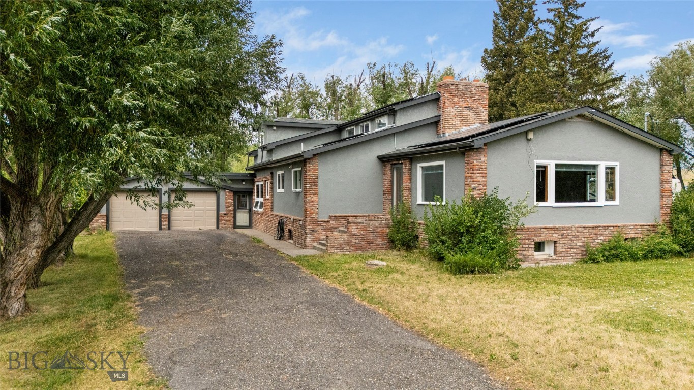 Experience rural tranquility with edge-of-town convenience in this beautifully upgraded 4-bedroom (2 bedrooms are non-conforming and are not legally considered bedrooms), 3-bath home set upon one acre. Located minutes from downtown Livingston, about 35 minutes to Bozeman, and one hour to Yellowstone National Park, you will enjoy privacy, space and quick access to world-class fishing, hiking, and the wonders of wildlife viewing in the Park. 

Inside, the home has been partially updated with fresh paint, some new flooring, updated cabinetry and countertops, and a finished basement. The thoughtful layout blends modern design with a more unique historic floor plan, creating multiple private areas throughout, ideal for multi-generational living or shared housing where everyone can feel as though they have their own space. The master suite features its own sitting area and a fully redone bathroom with a beautifully tiled shower designed for relaxation. There are two additional rooms in the basement that could be used as additional non-conforming bedrooms.

The heated and enclosed back sunroom adds a bright, year-round living space perfect for indoor gardening, morning coffee, or both. Recent upgrades include a new roof (2021), solar power system (2024), Pella windows, and Atrium doors. An attached four-car garage includes a separate 60-amp service, while the spacious detached shop with its own 200-amp service and metal siding offers ample room for projects, RV or boat storage, or even the potential to be converted into an additional dwelling.

Outside, mature trees surround the property, and an apple orchard and concord grapevines flourish through the seasons, offering beauty and potential home-grown harvests. 

With no known covenants or HOA, this property invites creativity and versatility, whether you’re looking for a family home, a vacation retreat, or a unique mixed-use opportunity. Here you will discover a private haven amidst the growing town of Livingston. Buyer and Buyer's Agent to verify all listing information contained herein. Seller offering very attractive financing. Call today to schedule an in-person showing.