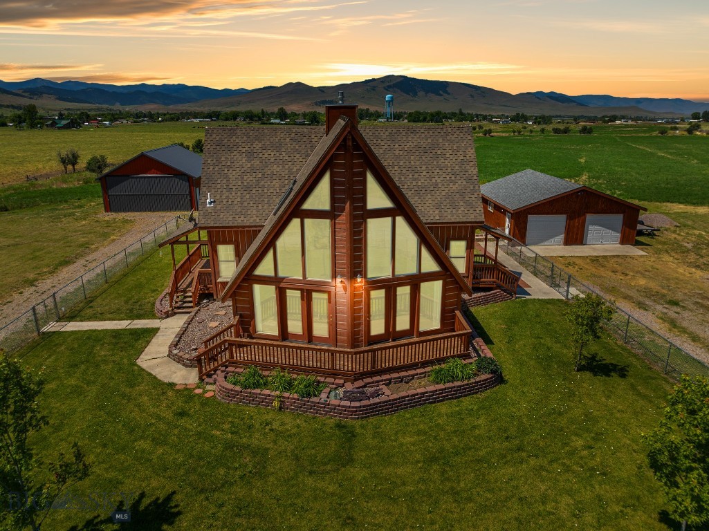 Welcome to your dream estate in St. Ignatius, Montana! This 4.65-acre property offers a harmonious blend of quality living, adventure, and natural beauty. With stunning views of the Mission Mountains, including the iconic Garden Wall, this property is truly one-of-a-kind.

The main residence features spacious, light-filled living areas with breathtaking mountain views, creating a warm and inviting atmosphere. The modern kitchen, equipped with impressive counter space, is perfect for culinary enthusiasts. Cozy and comfortable bedrooms are designed for ultimate relaxation, with the primary suite on its own level for added privacy. The deck provides an ideal space for entertaining guests or simply soaking in the stunning scenery.

The secondary home is perfect for guests or tenants, offering bright and welcoming living space, a functional kitchen with all necessary amenities, and comfortable, inviting bedroom. The bathroom meets your needs, including laundry facilities, and a fenced outdoor area of its own allows you to enjoy the mesmerizing surroundings.

The property includes a rare feature: platted access easement to the adjacent airport, presenting unique options. A detached garage and shop space offers additional storage and parking for vehicles or equipment. The expansive grounds offer plenty of room for gardening, outdoor recreation, or future expansion. Unobstructed, panoramic views of the Mission Mountains create a picturesque backdrop for everyday living.

Located in an inspiring setting, this property is also conveniently close to local amenities. You'll enjoy the intimacy of rural living, with Missoula just a 45-minute drive away, and the recreational opportunities of Flathead Lake are within easy reach, just 35 minutes north. Outdoor adventures abound, and a vibrant local community awaits.

This 4.65-acre estate is more than just a home; it's a lifestyle. Whether you're seeking a peaceful retreat with awe-inspiring views, this property offers a unique and unparalleled living experience. Don't miss the chance to own this extraordinary piece of paradise.