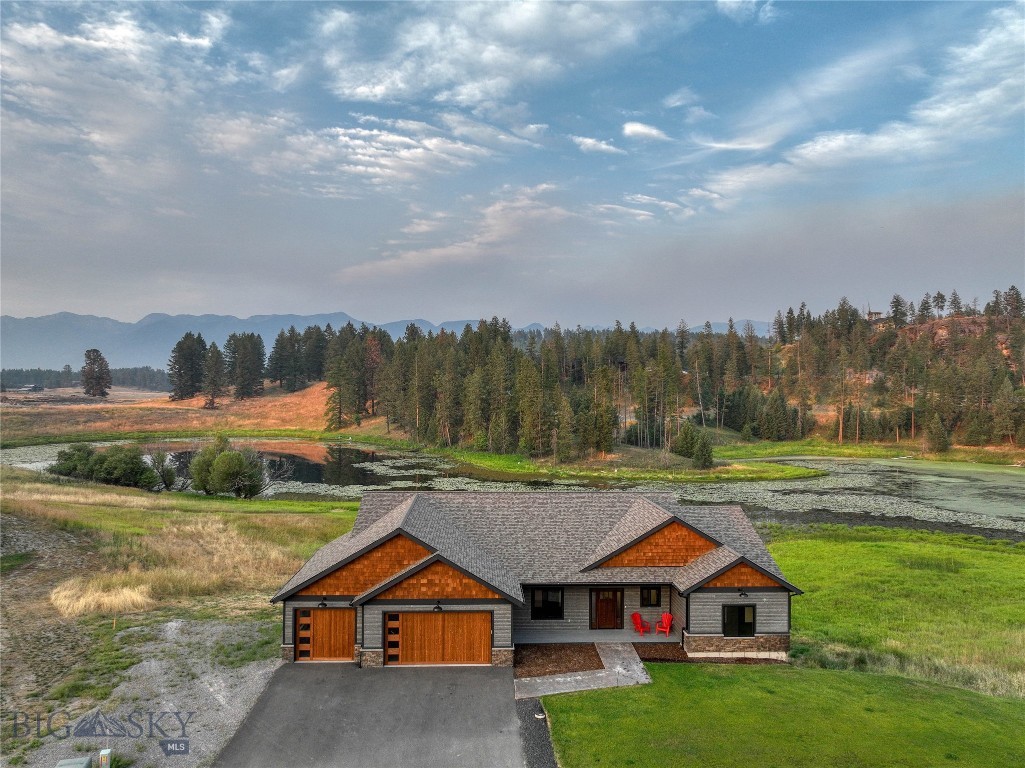 ~2025 PARADE OF HOMES MASTERPIECE (ONLY 13 Homes Presented) ~ Bigfork Rodeo Price Reduction this week only! 
This beautiful, custom-built home is only a few minutes outside of Bigfork but offers all the quaintness of a homey remote cabin on a pond. It is an entertainer