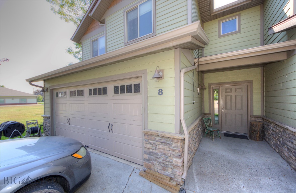 FINELY APPOINTED 3 BEDROOM 2.5 BATHROOM TWO LEVEL CONDOMINIUM WITH NEW HARD WOOD FLOORING AND A ROCKED GAS FIREPLACE ON THE MAIN LEVEL.  NEW CARPETING UP THE STAIRS AND THE ENTIRE UPSTAIRS.  HALF BATH ON MAIN LEVEL AND TWO BATHROOMS UP.  THIS IS AN END UNIT WITH LOTS OF NICE EAST SUNLIGHT, A BACK PATIO AND AN ATTACHED TWO CAR GARAGE.  THIS UNIT IS SITUATED NEXT TO A LARGE OPEN LOT FOR THE TIME BEING.  CLOSE TO ALL YOUR NEEDS.  CALL TODAY FOR AN APPOINTMENT TO VIEW THIS TERRIFIC CONDOMINIUM THAT MAY JUST END UP BEING YOUR NEW HOME.