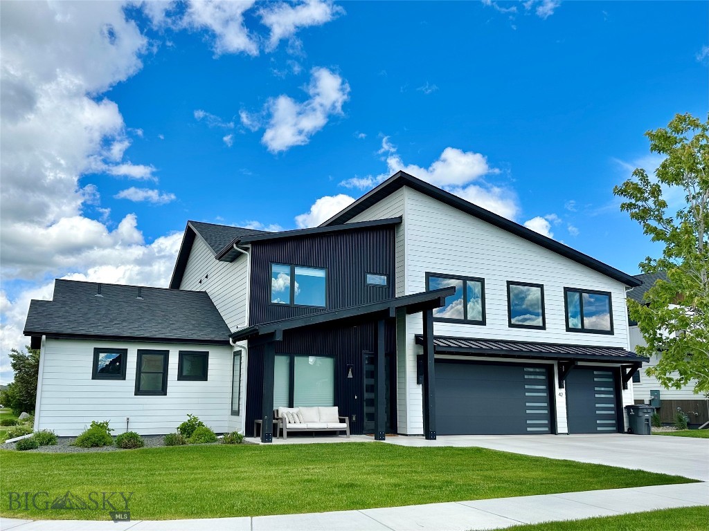 Luxury custom home with mountain views. Discover exceptional craftsmanship, thoughtful design, and modern luxury in this stunning custom-built residence boasting 3,880 square feet of elegantly finished living space in one of Bozeman’s most coveted neighborhoods. With 5 bedrooms, including an exclusive primary suite, this home is perfect for both everyday living and entertaining. Soaring 18-foot ceilings, a cozy fireplace, exposed kitchen beams, expansive windows, and impressive 4-panel oversized sliding glass doors fill the home with natural light and showcase mountains and the views of adjacent neighborhood park. 

At the heart of the home is a spacious chef’s kitchen, featuring a large island with storage on both sides, luxurious marbled countertops, a built-in wall oven, a 36-inch LG Signature induction cooktop with designer hood, and premium LG Signature appliances. For those who prefer cooking with gas, a gas line is already installed for easy conversion. An oversized walk-in pantry with an additional refrigerator offers exceptional storage and convenience.  The flexible floor plan includes a dedicated office for remote work or study.
The primary suite offers privacy and spa-like amenities. Additional bedrooms and bathrooms provide comfort for family and guests. Two laundry rooms and a spacious mudroom were added for convenience. Furthermore, upstairs, there is a large bonus/recreation room above the garage and feature zoned LED lighting and electric blinds. 

Designed with comfort and efficiency in mind, this home includes a three-zone heating and air conditioning system—serving the primary suite, main level, and upper level independently—high-end Marvin windows, a recirculating hot water system with 100-gallon capacity, water softener stub-out, cable and power connections in every bedroom, and luxury vinyl plank flooring throughout.

The backyard features mature landscaping, mountain views, and a patio with gas and electric hookups. The home also offers a heated three-car garage and modern entry door. Furnishings are available for purchase separately.

Blending luxury, comfort, and Bozeman’s sought-after lifestyle, this home unites high-end finishes and timeless design in a remarkable setting.