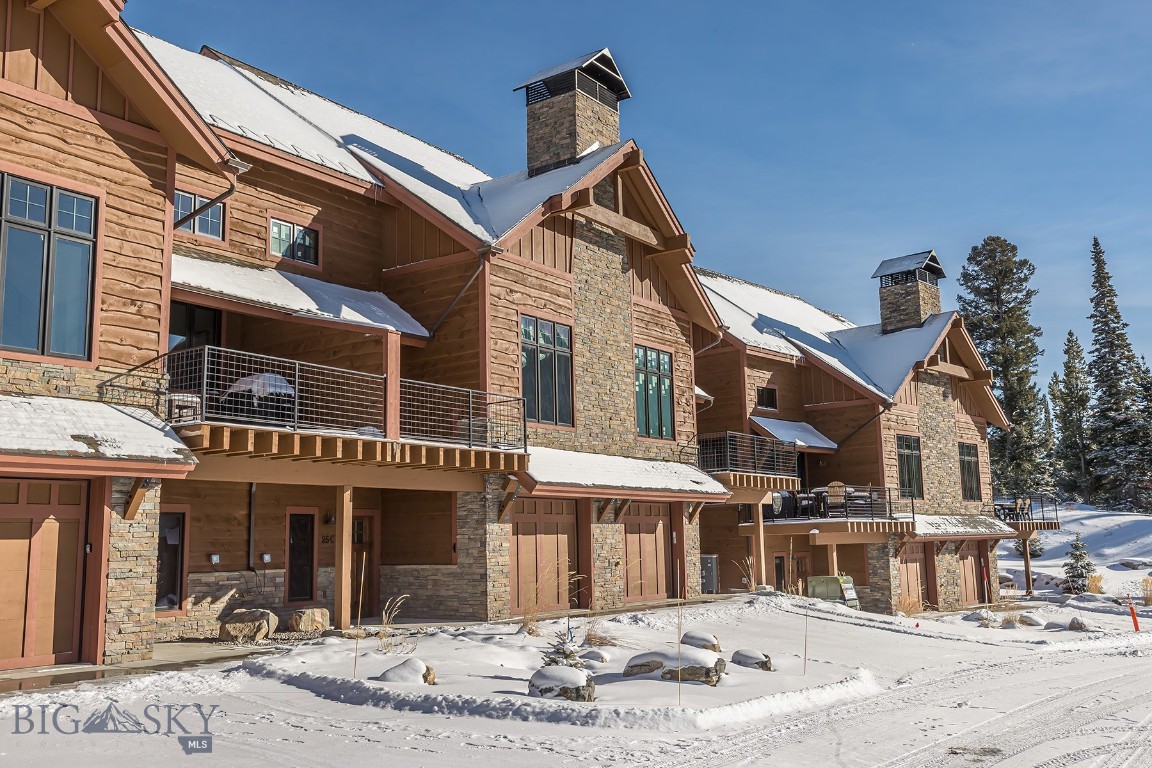 Welcome to a 4 bedroom refined mountain retreat where modern comfort meets timeless style. Ideally positioned in the highly sought-after back row, this residence sits at a naturally higher vantage point—offering even more dramatic, unobstructed views of Lone Peak right from your living room and deck.  The gourmet kitchen is designed for both beauty and function, showcasing high-end appliances, elegant finishes, and ample workspace for effortless cooking and entertaining.  Step out onto the expanded deck—larger than those found in earlier phases—to enjoy morning coffee, evening sunsets, or simply soak in the unmatched alpine scenery.  Don’t miss the chance to experience Big Sky living at its finest—your elevated alpine escape awaits.   Interior of condo under construction, interior photos are of a similar unit