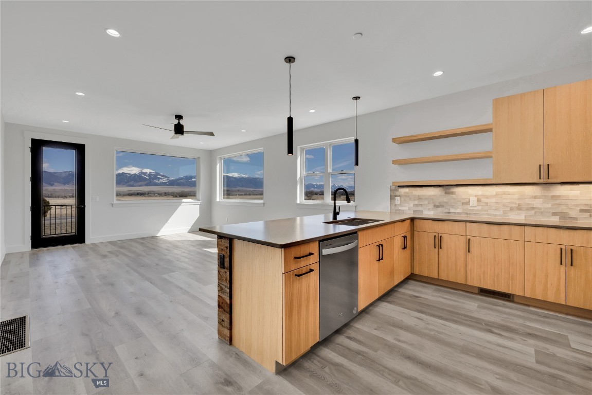 Set against the wide-open landscapes and river corridors that define the Madison Valley, The Drift at North Forty offers a rare opportunity to own new construction in the heart of Ennis. Located within walking distance of Main Street and minutes from the Madison River, these 3-bedroom, 2-bathroom residences provide immediate access to both town and open country.

Each home is designed for low-maintenance living with an open-concept layout and expansive windows that frame mountain views and fill the space with natural light. Finishes are durable and clean, designed with a timeless aesthetic that complements the surrounding landscape. The interiors balance practicality and comfort, making the home equally suited for everyday living and extended stays.

The walkout primary suite offers privacy and direct outdoor access, while two additional bedrooms allow flexibility for guests, family, or a home office. An attached one-car garage provides protected parking, and the dedicated storage room offers additional flexibility for fly tying, workout equipment, a small home gym, or organized gear storage.

Upper-level residences benefit from elevated sightlines and broader valley views. Short-term rentals are permitted, offering owners the option to enjoy the property personally while maintaining income flexibility.

World-class fly fishing on the Madison River, hunting and hiking on nearby public lands, and skiing at Big Sky Resort are all within easy reach. Yellowstone National Park and Bozeman Yellowstone International Airport are approximately an hour away, making The Drift at North Forty a well-positioned base for year-round use in the Madison Valley.